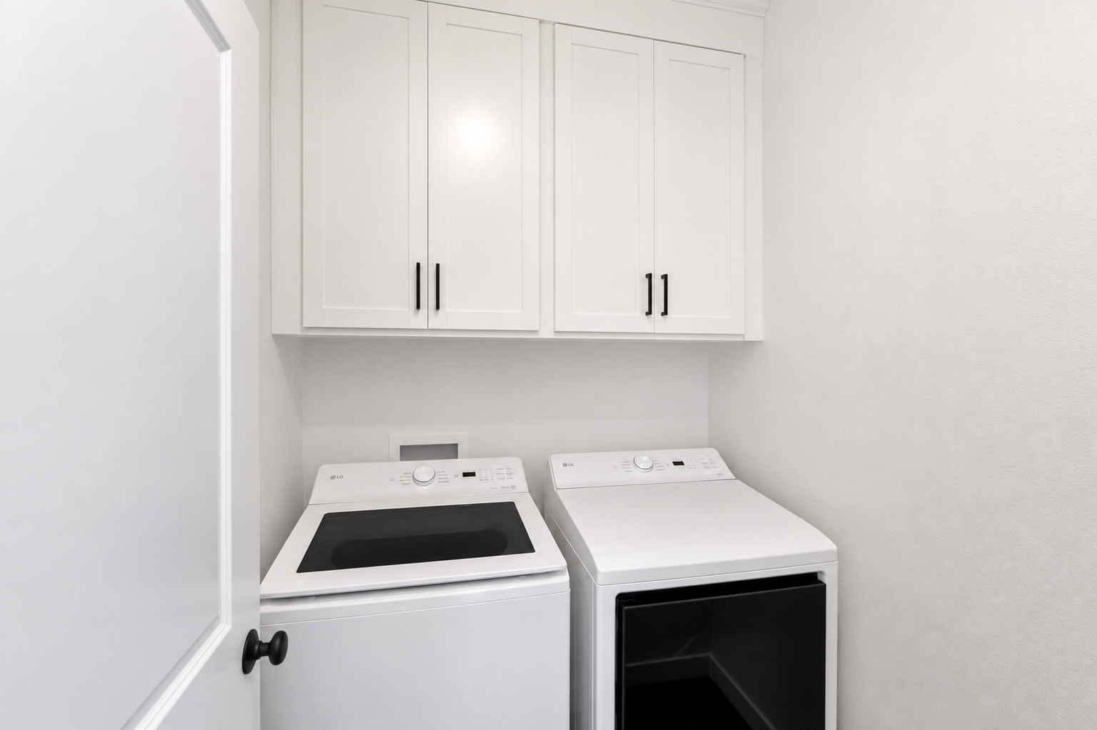 A white kitchen with white cabinets.