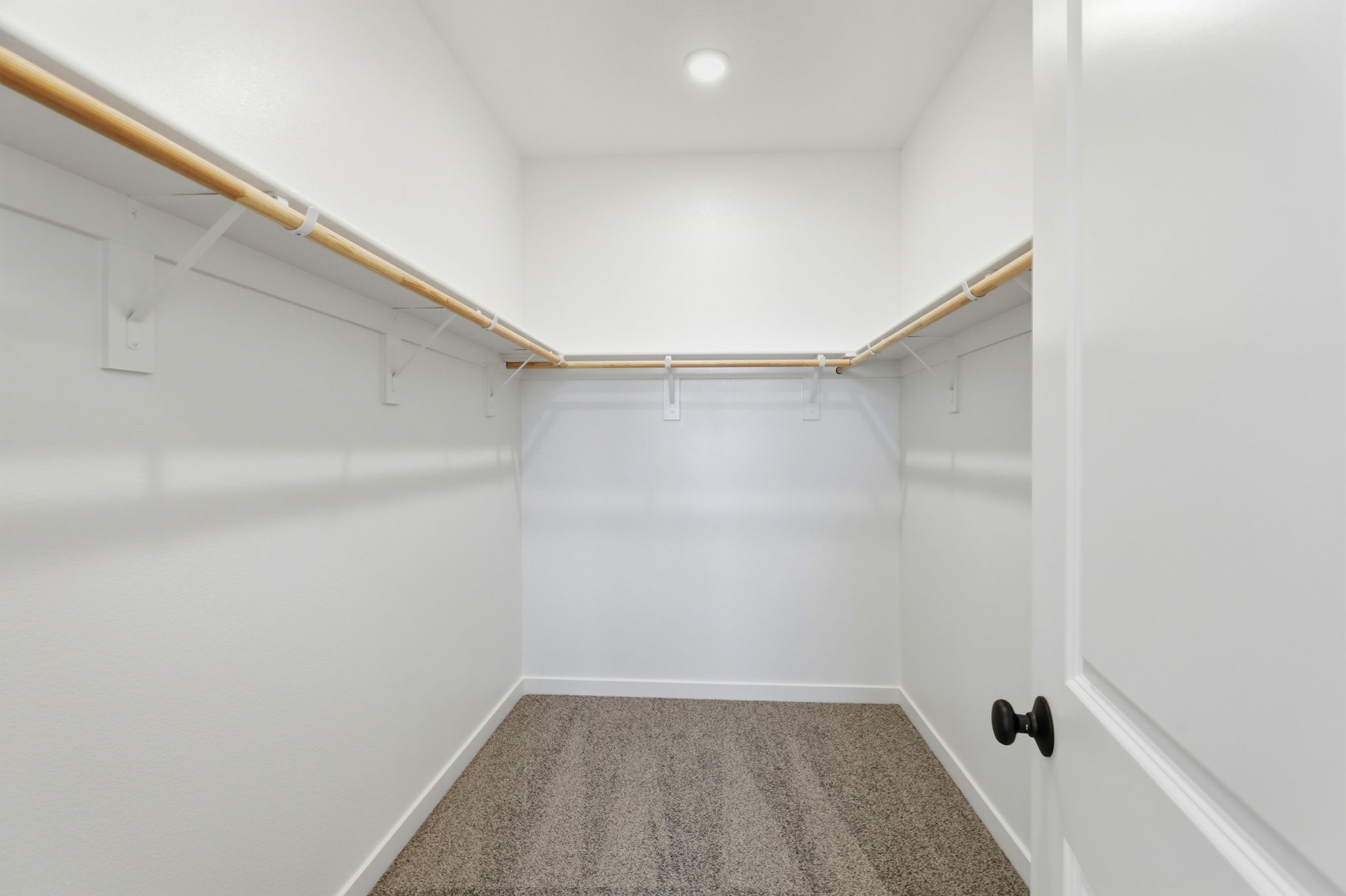 A hallway with white walls.