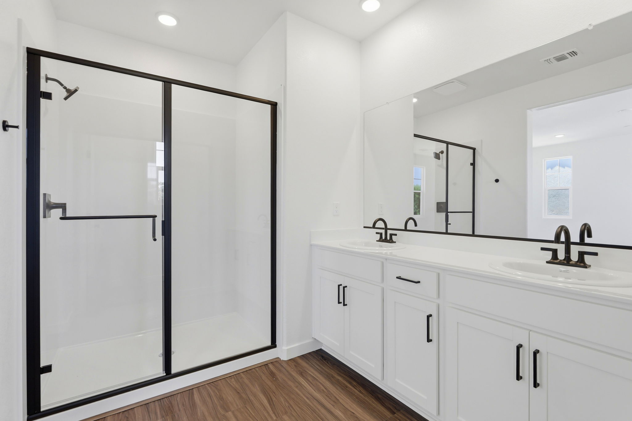 A bathroom with a glass shower.