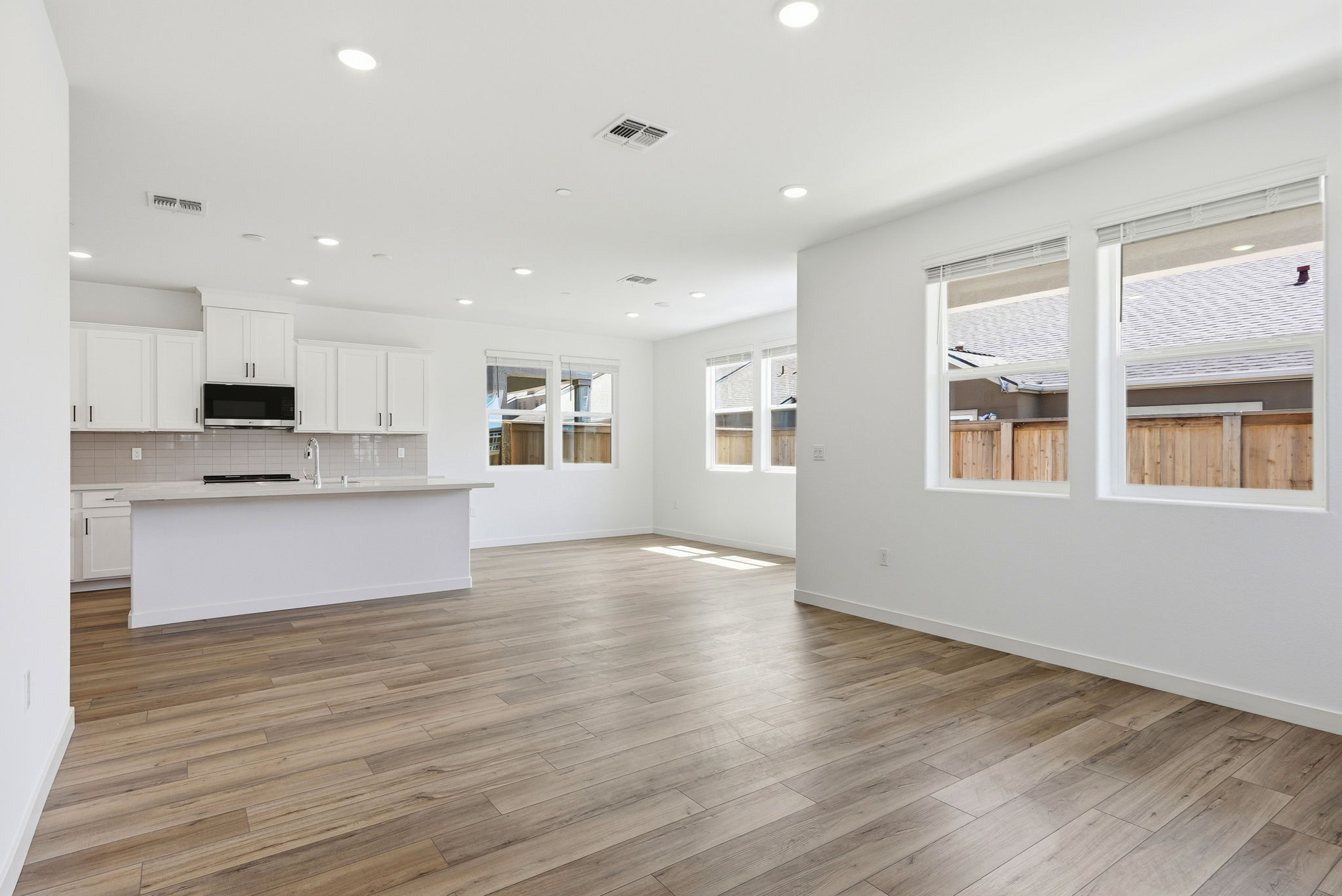 A large kitchen with white cabinets.