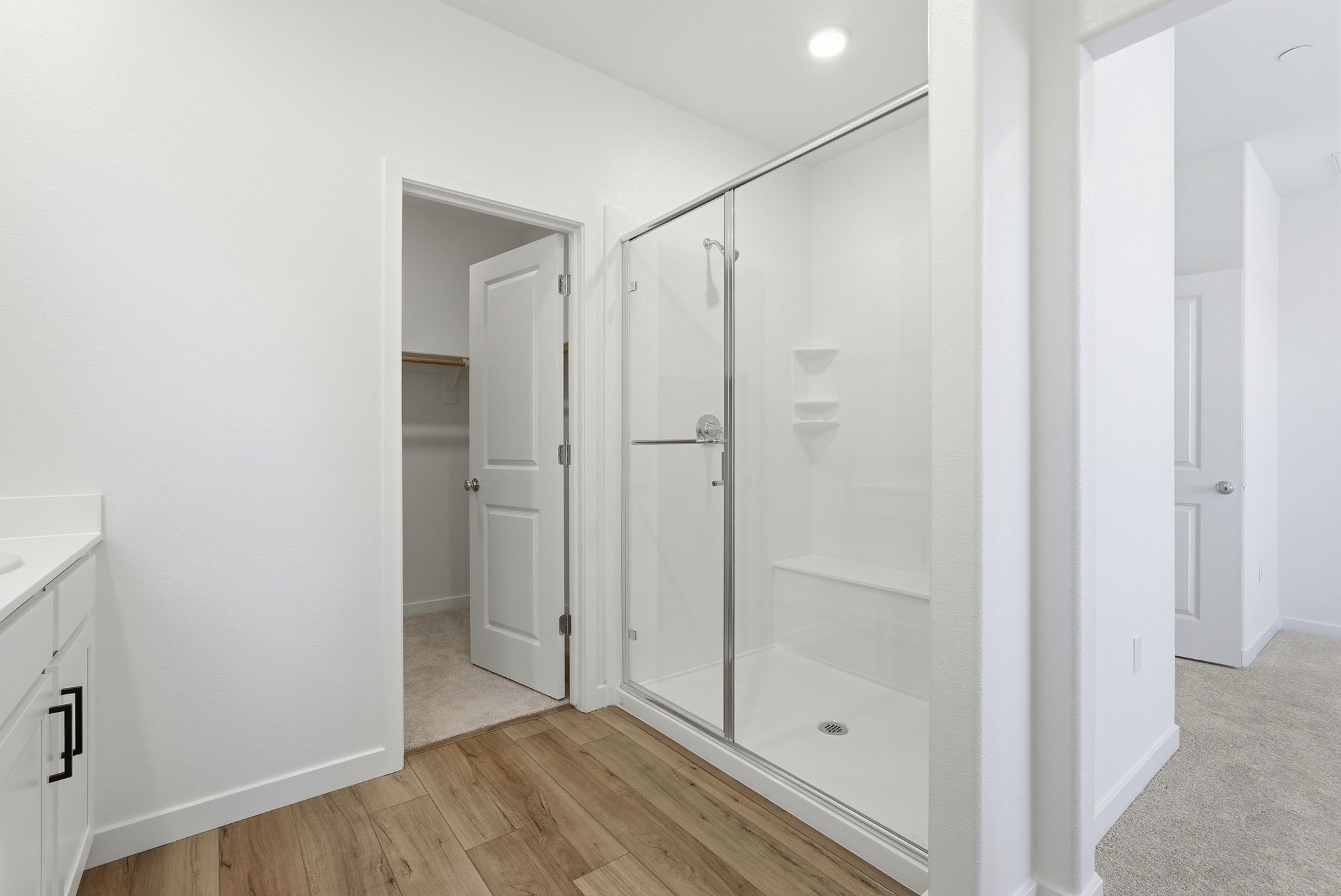 A bathroom with a glass shower.