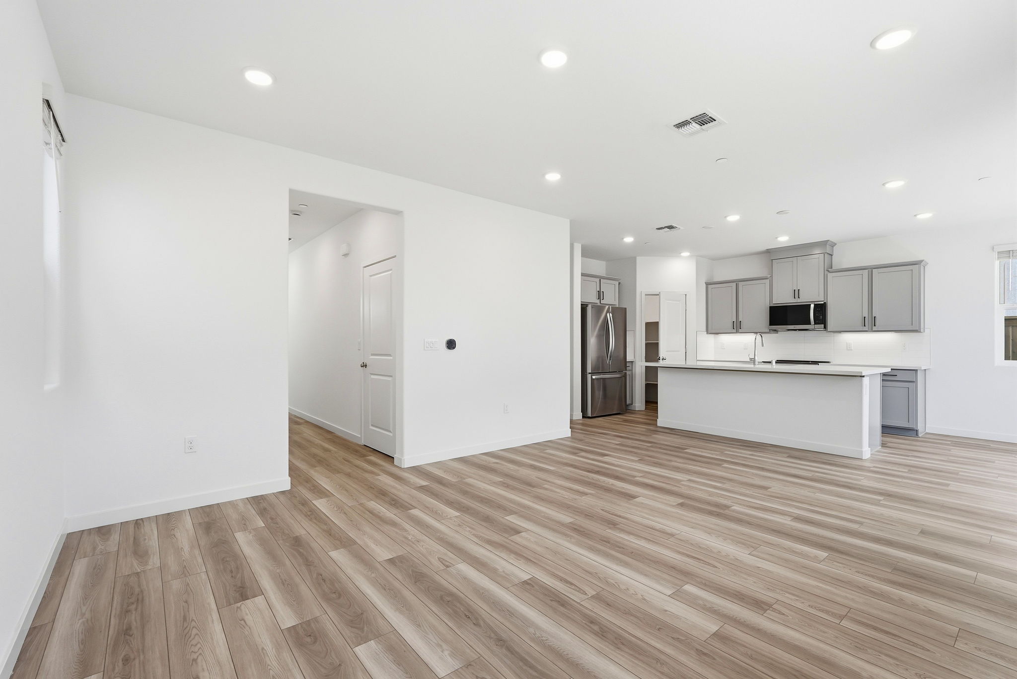 A kitchen with white walls.