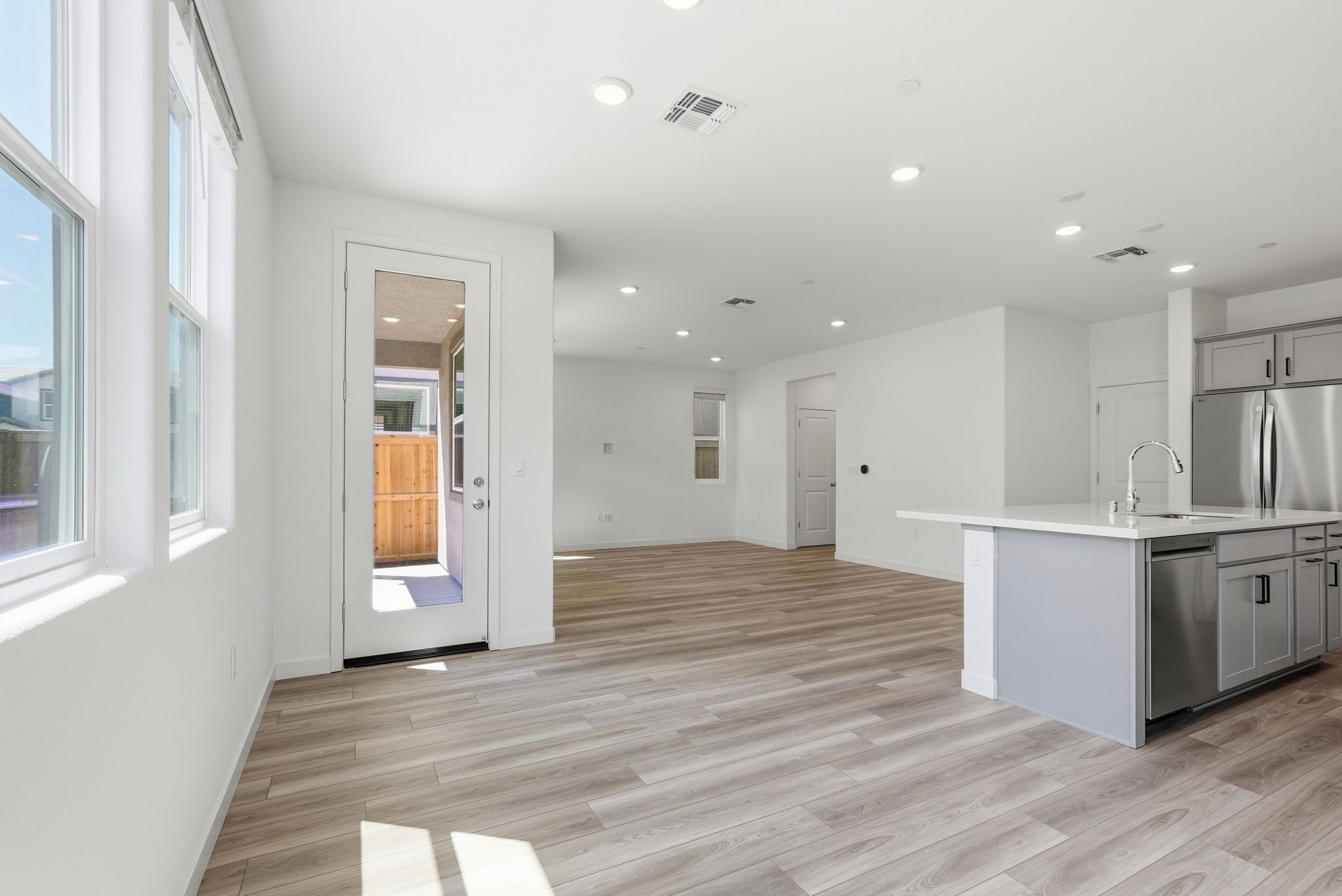 A kitchen with wooden floors.
