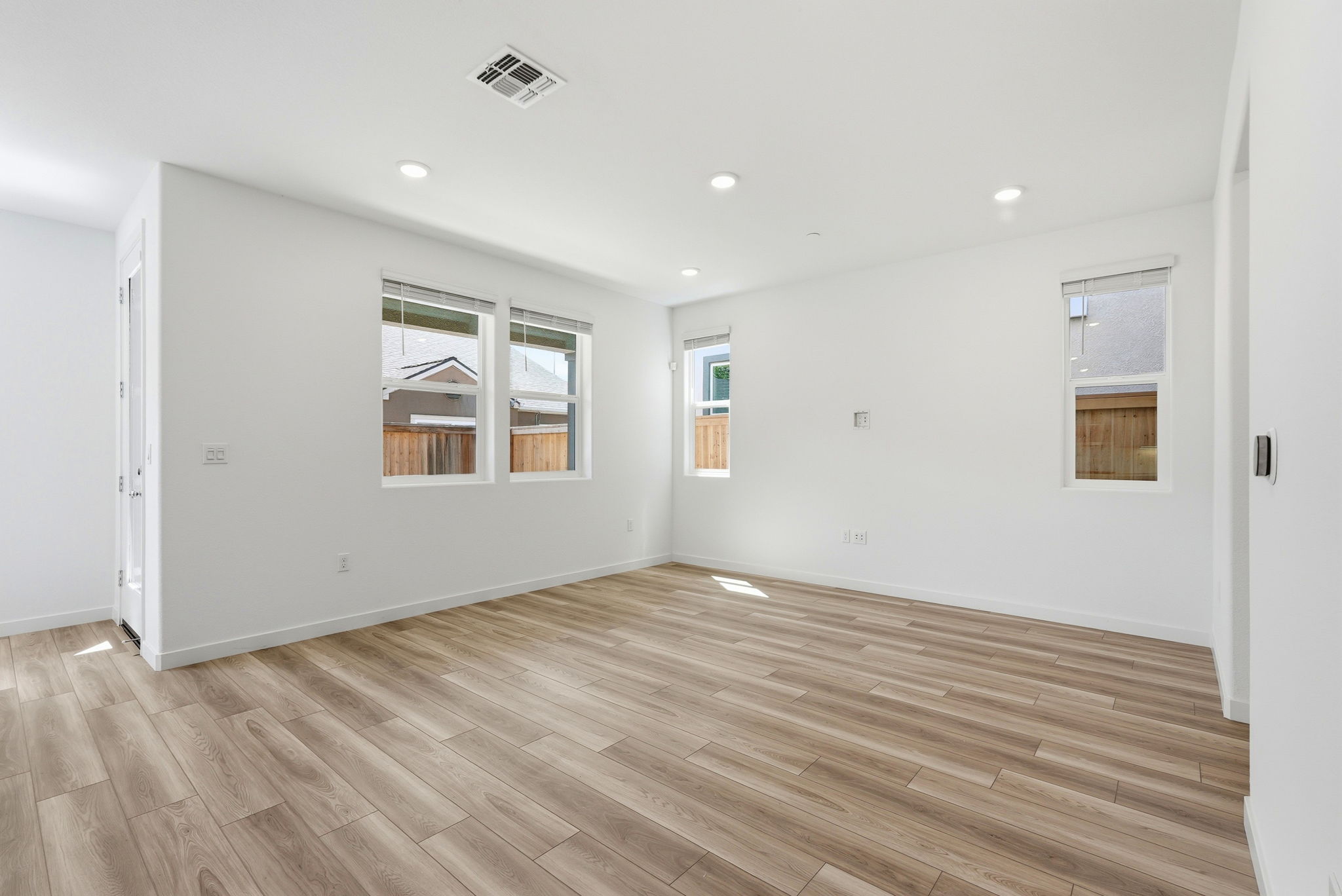 A room with a wood floor and a wood floor.