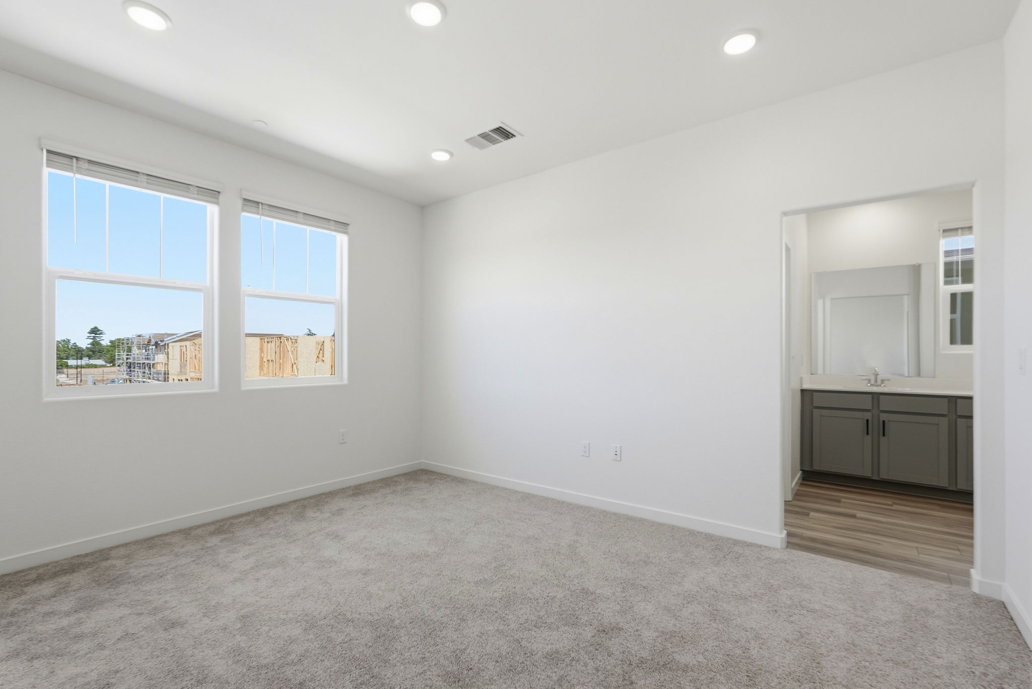 A room with a window and a door.