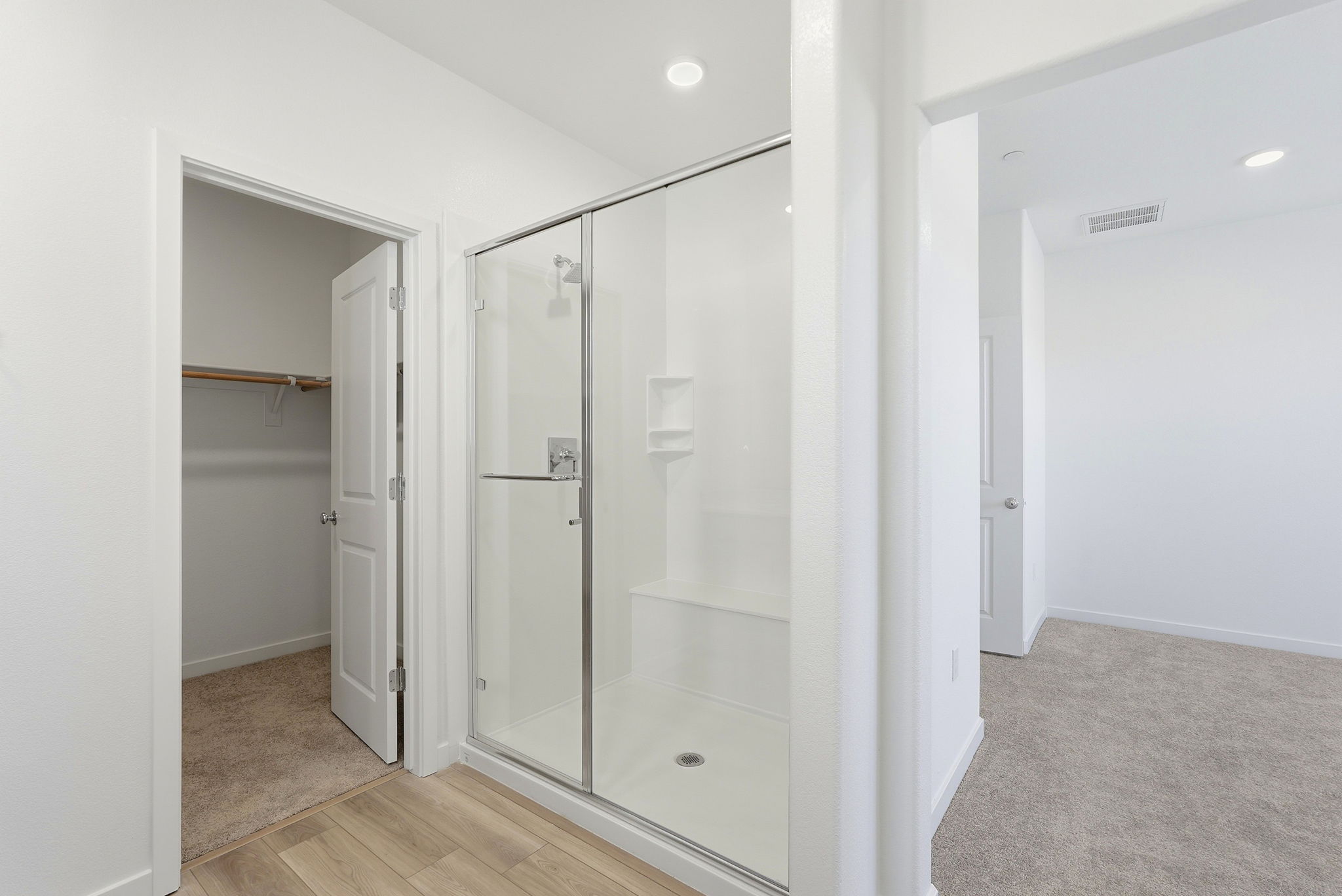 A bathroom with a glass shower.
