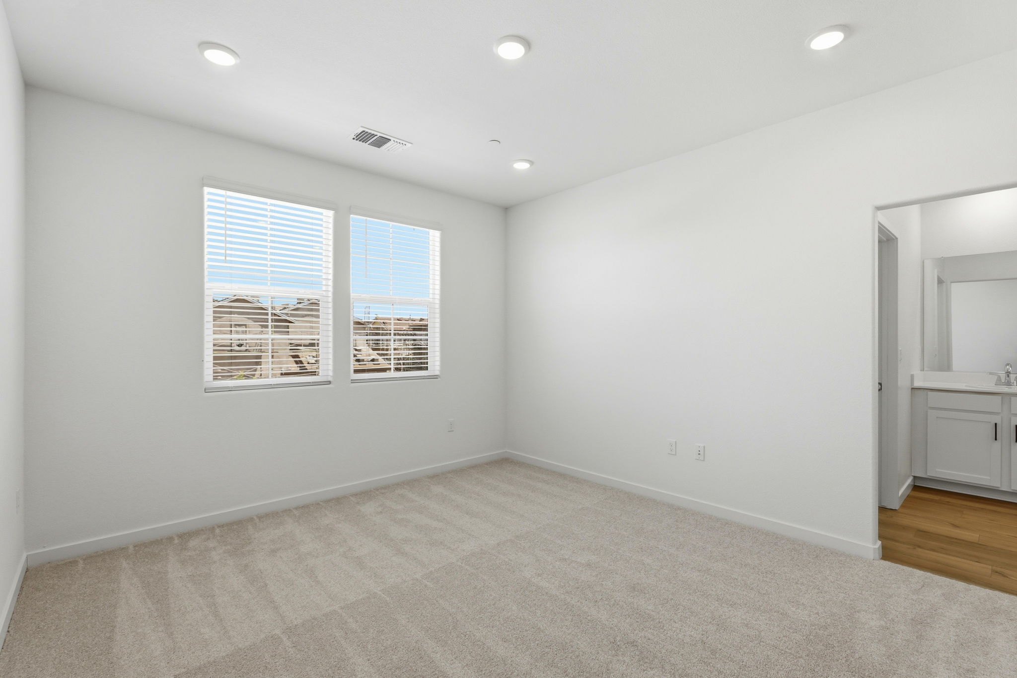 A room with a window and a door.