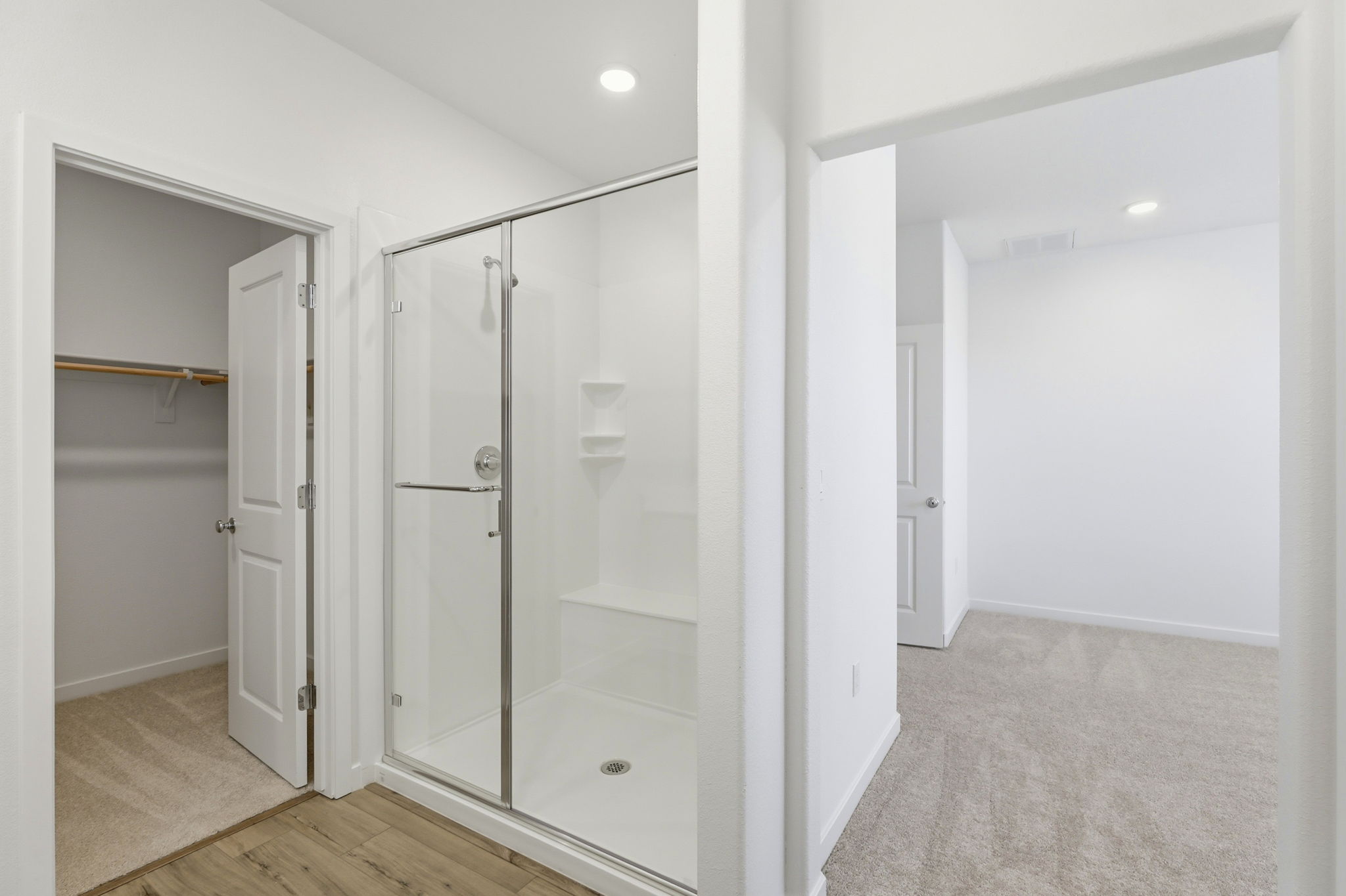 A bathroom with a glass shower.