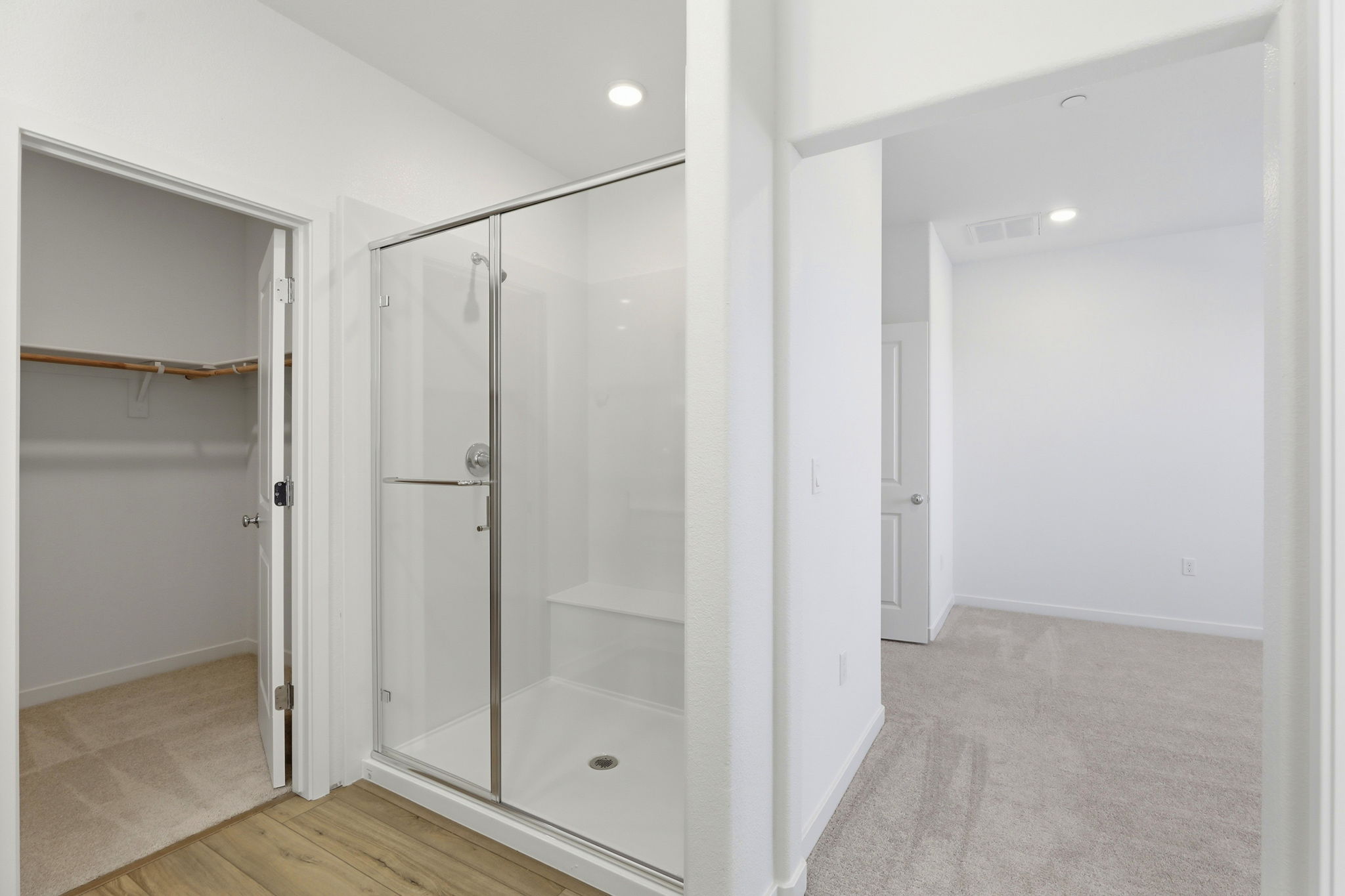 A bathroom with a glass shower.