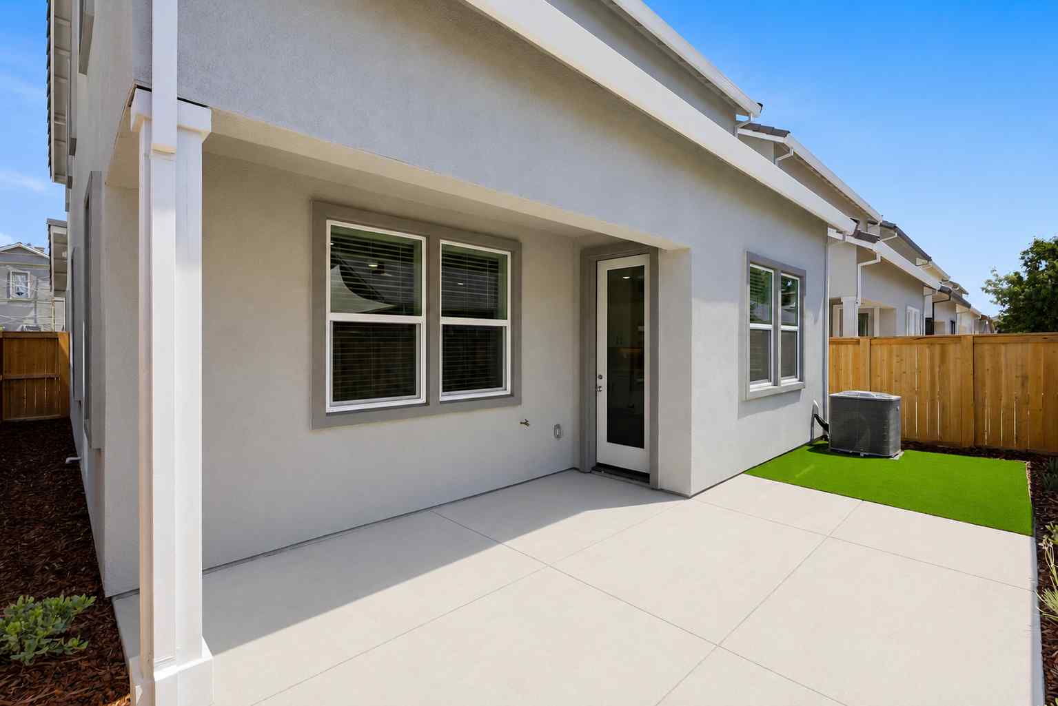 A house with a fence and a yard.