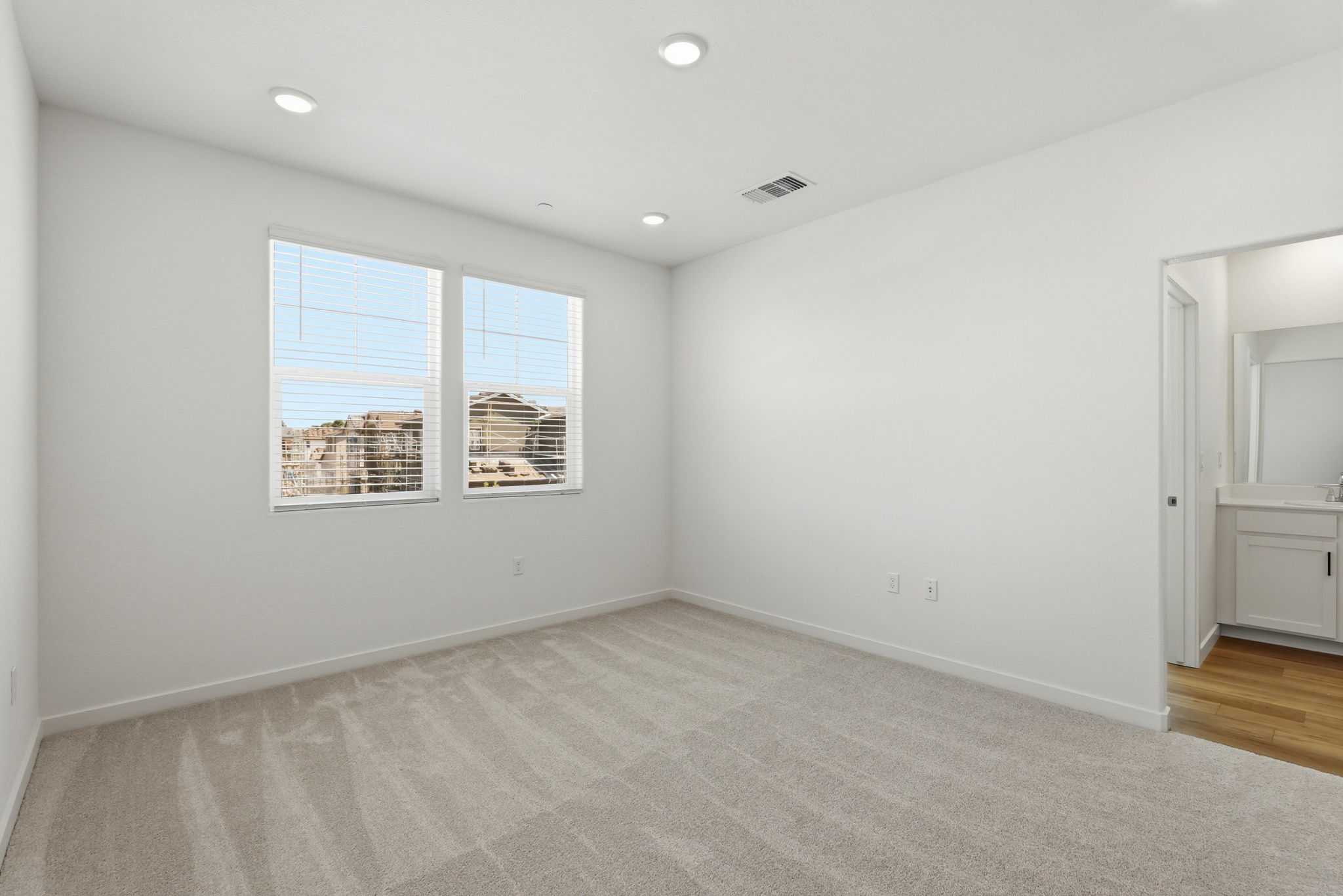 A room with a window and a door.