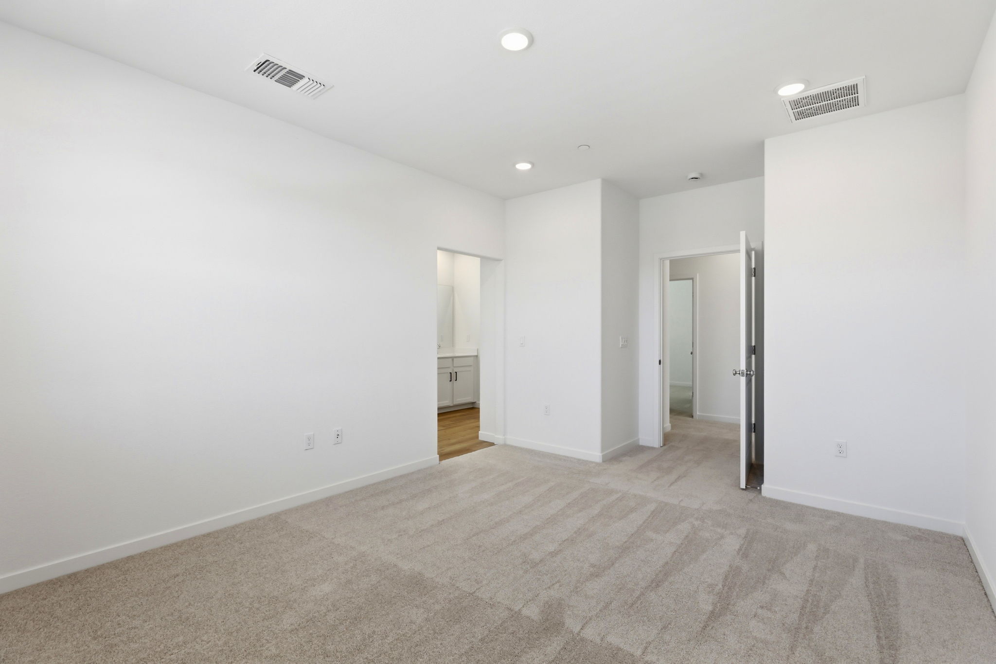 A long hallway with white walls.