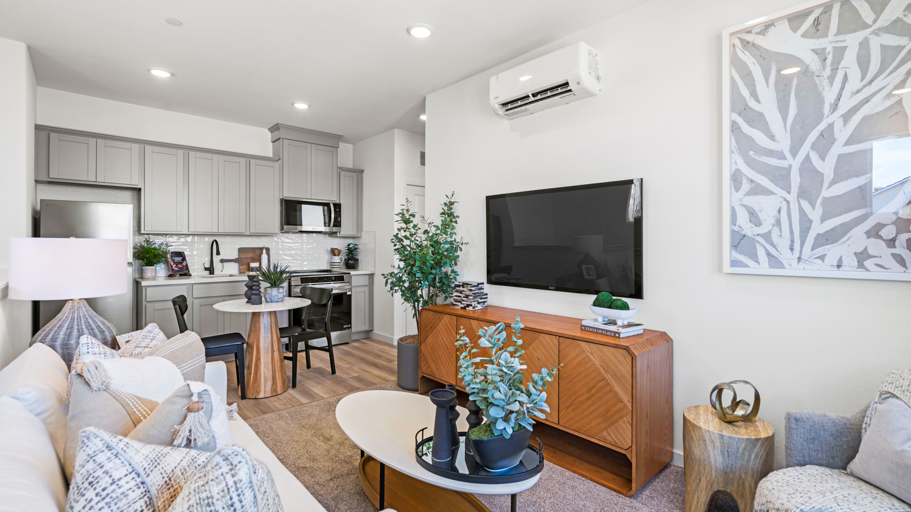 A living room with a tv and couches.