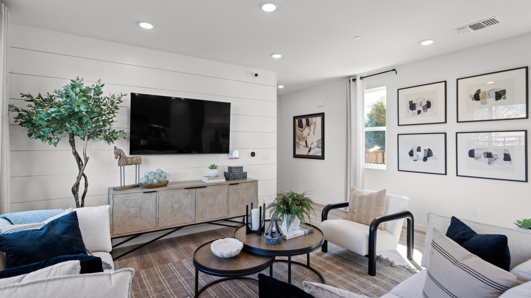 A living room with a tv and couches.