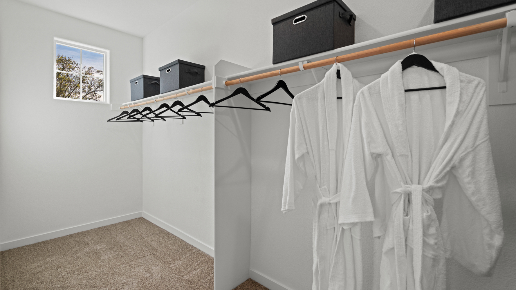 A white dress on a swinger in a room.