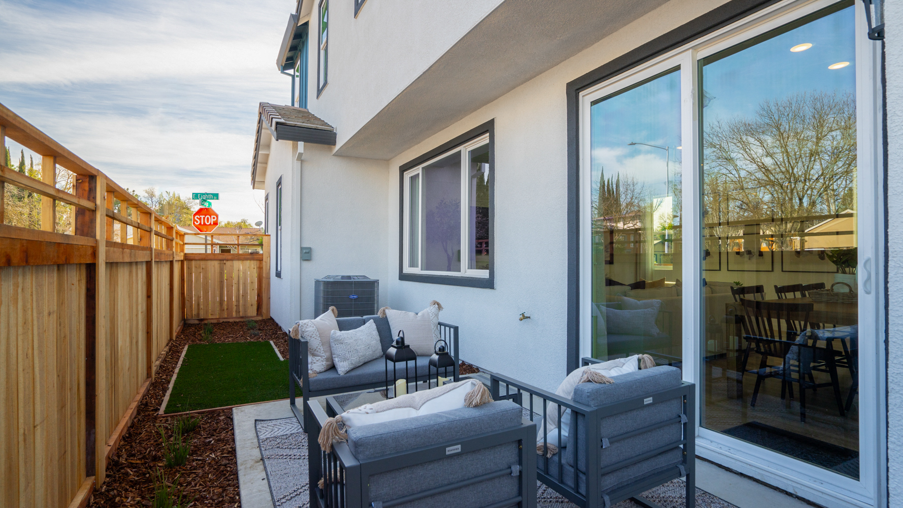 A house with a deck and a pool.