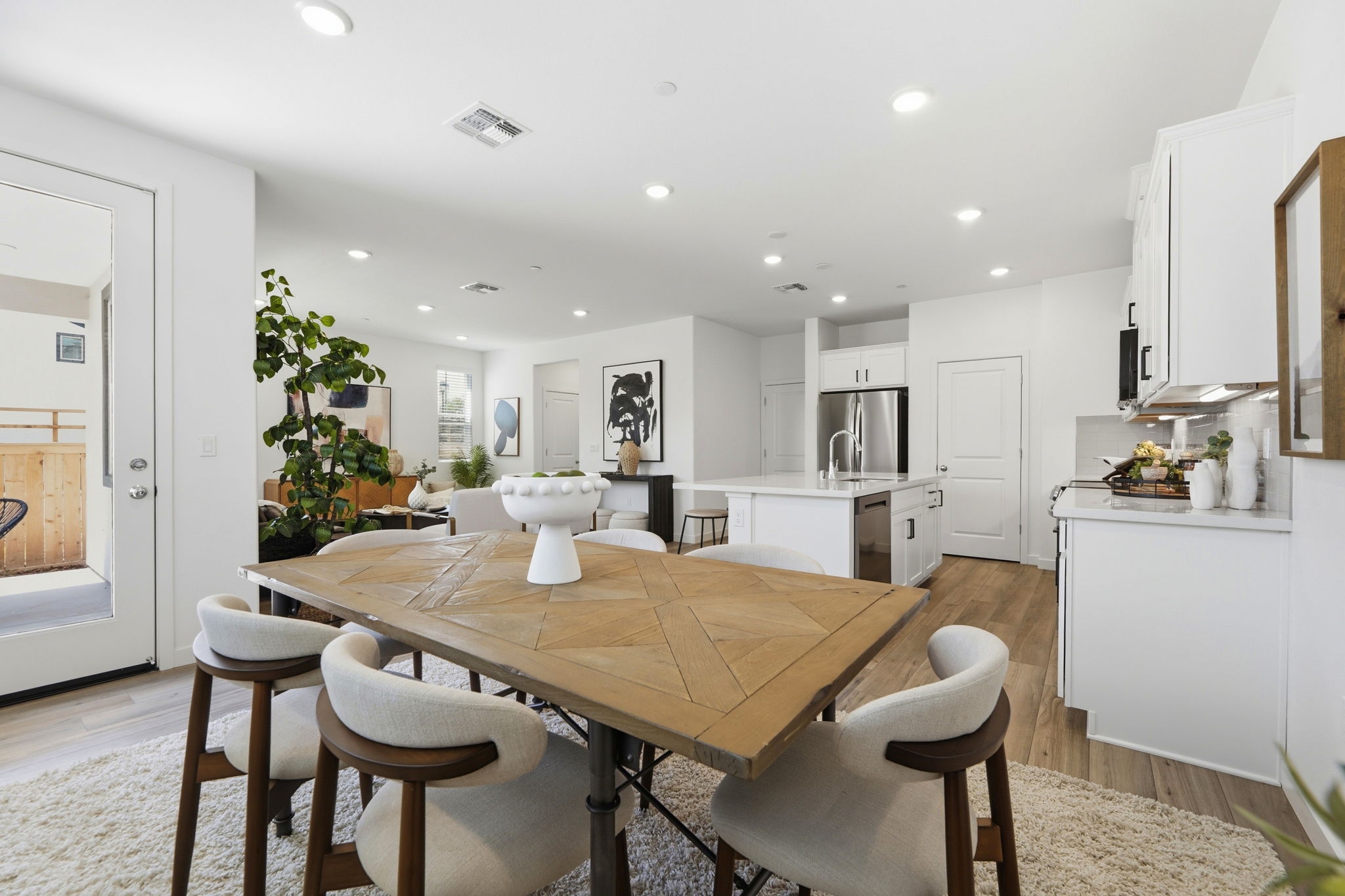 A kitchen with a dining table.