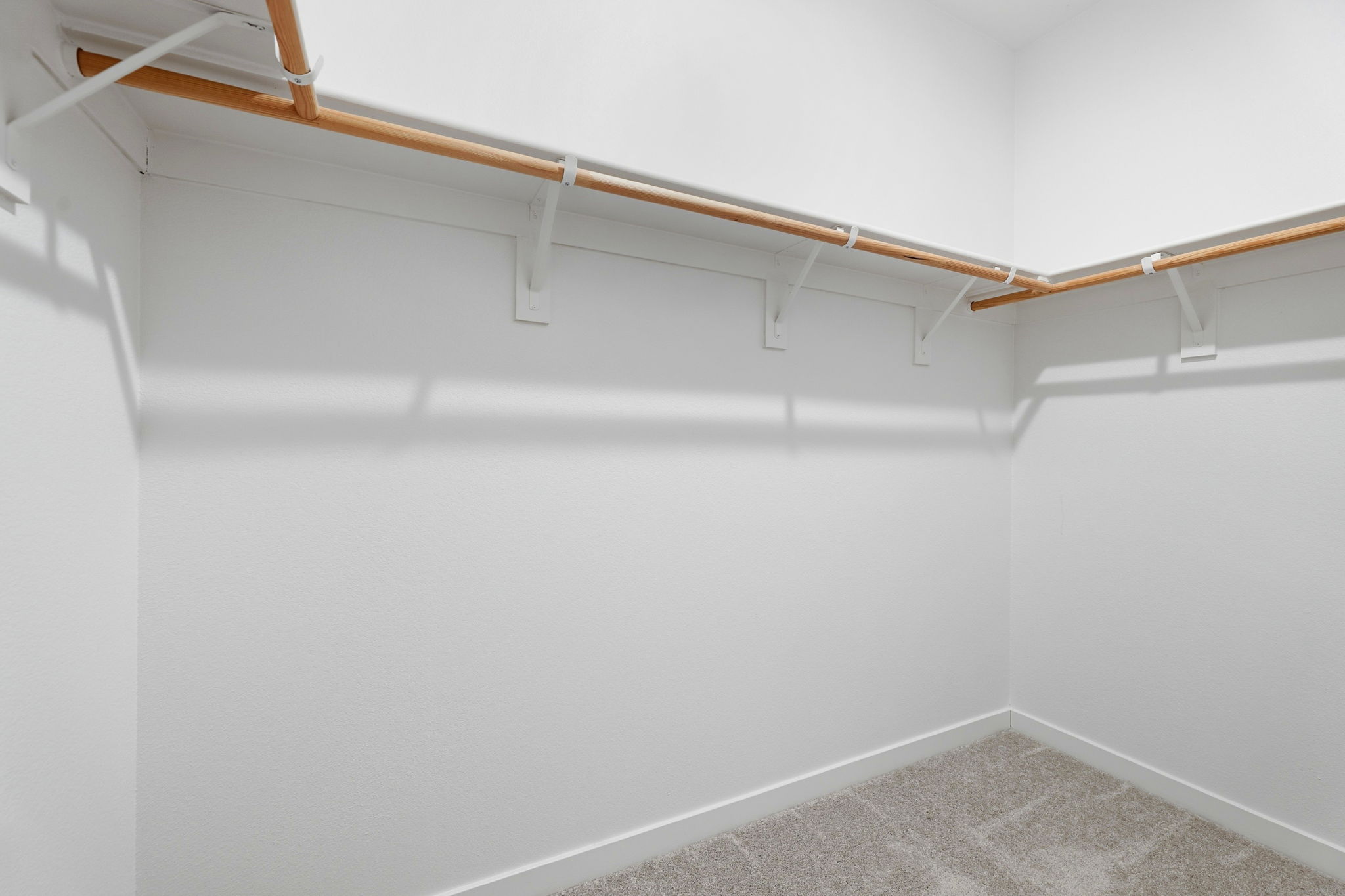 A white wall with a white floor.
