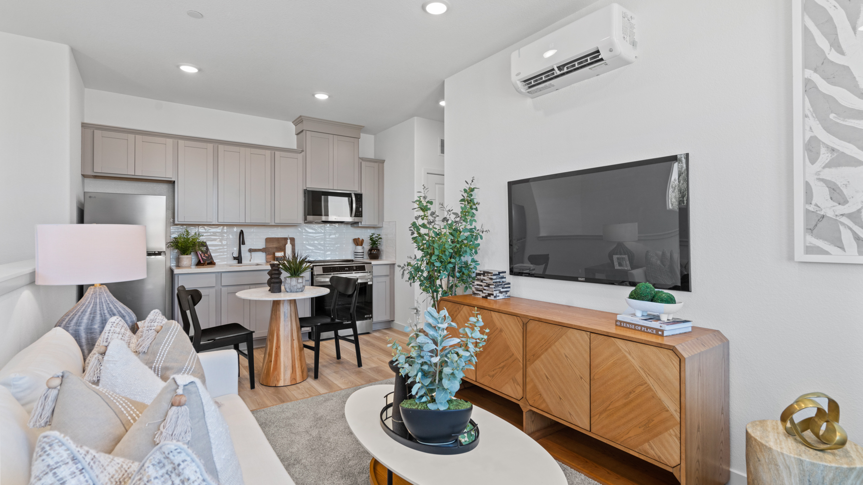 A living room with a tv and furniture.