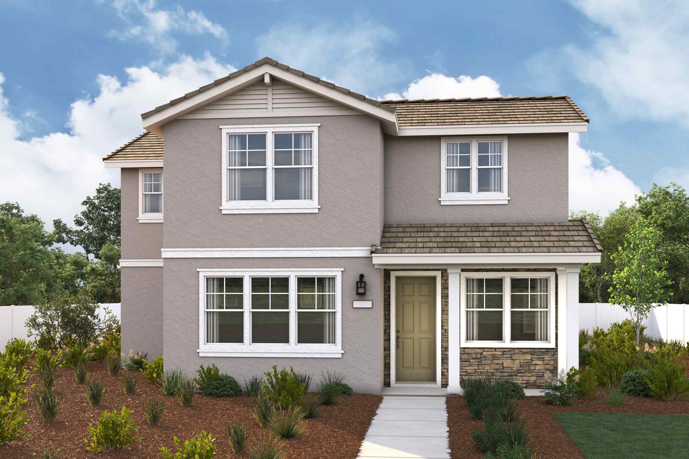 A house with a brick driveway.