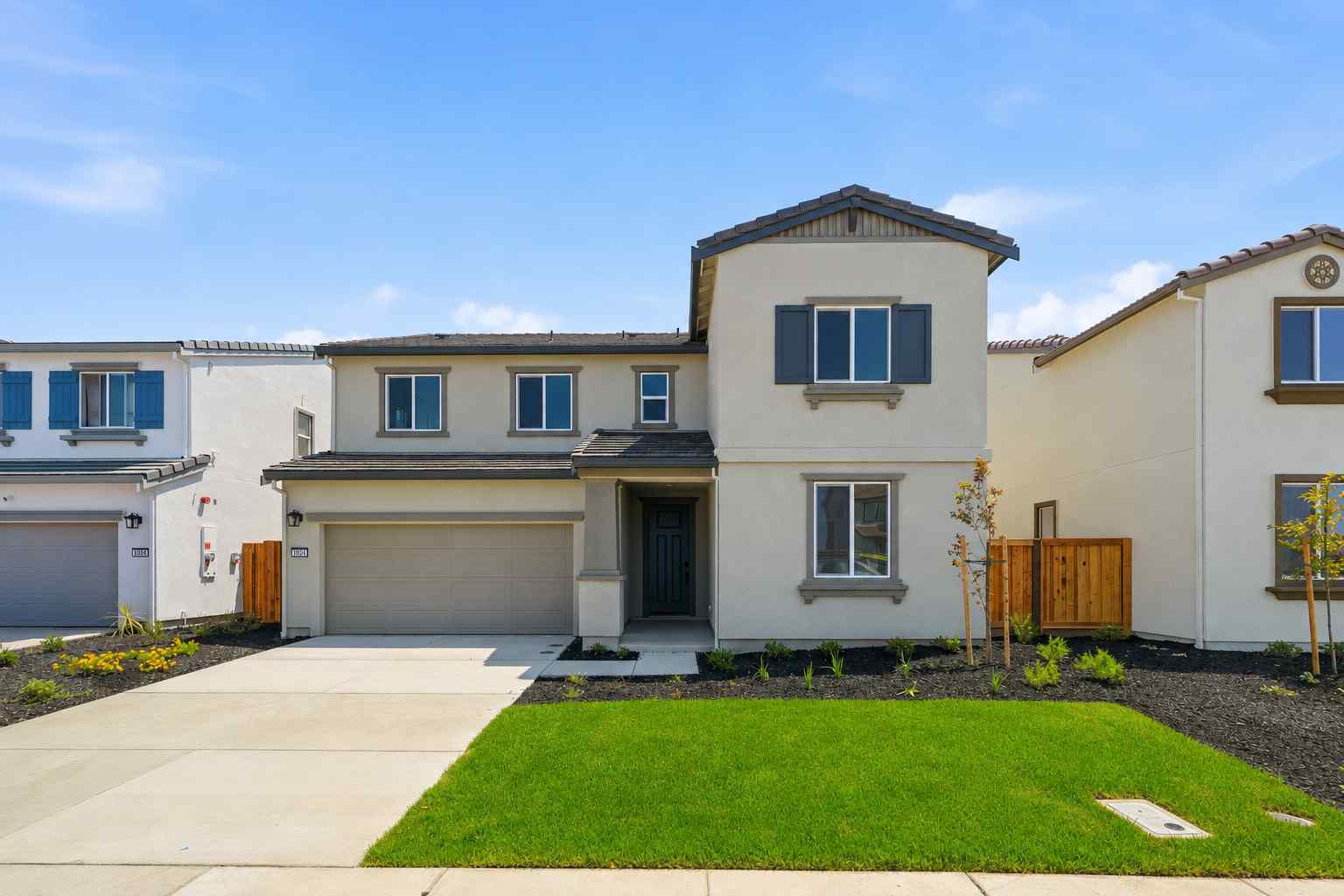 A house with a green lawn.