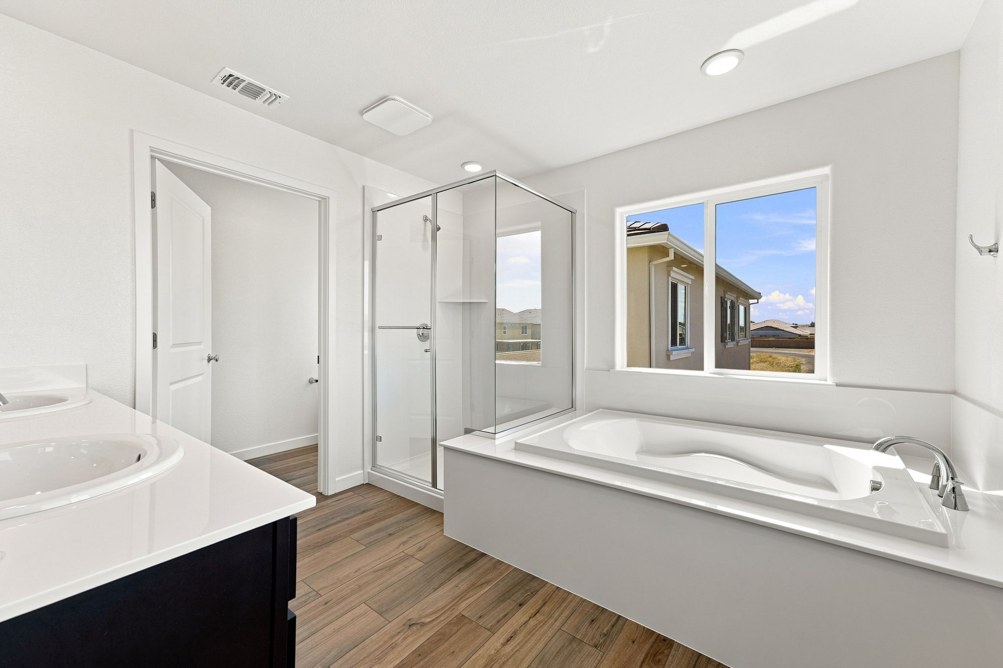 A bathroom with a tub and sink.