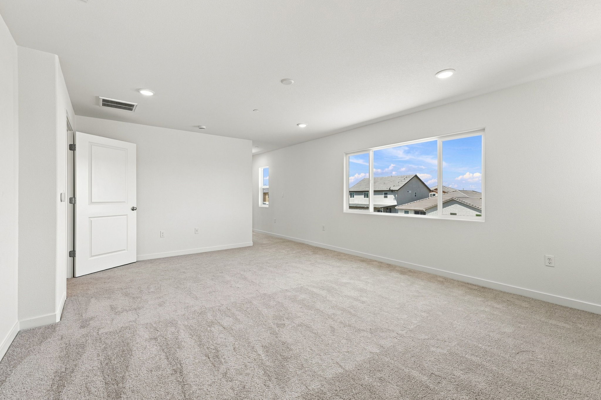 A room with a large window.