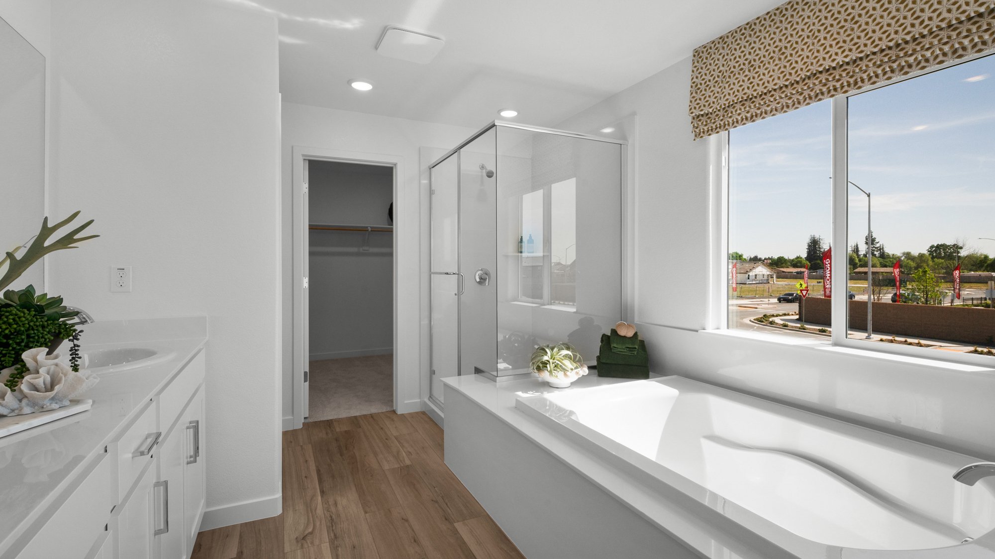 A bathroom with a tub and sink.