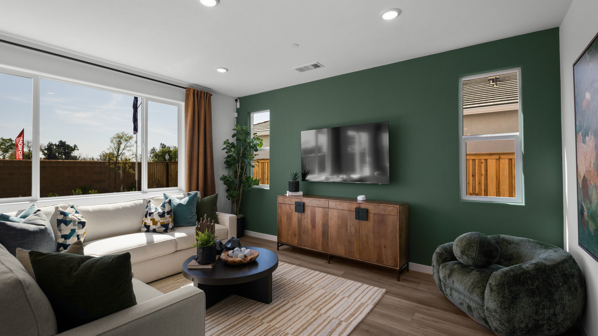 A living room with a tv and couches.