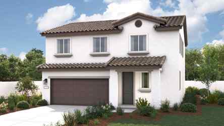 A white house with a garage.