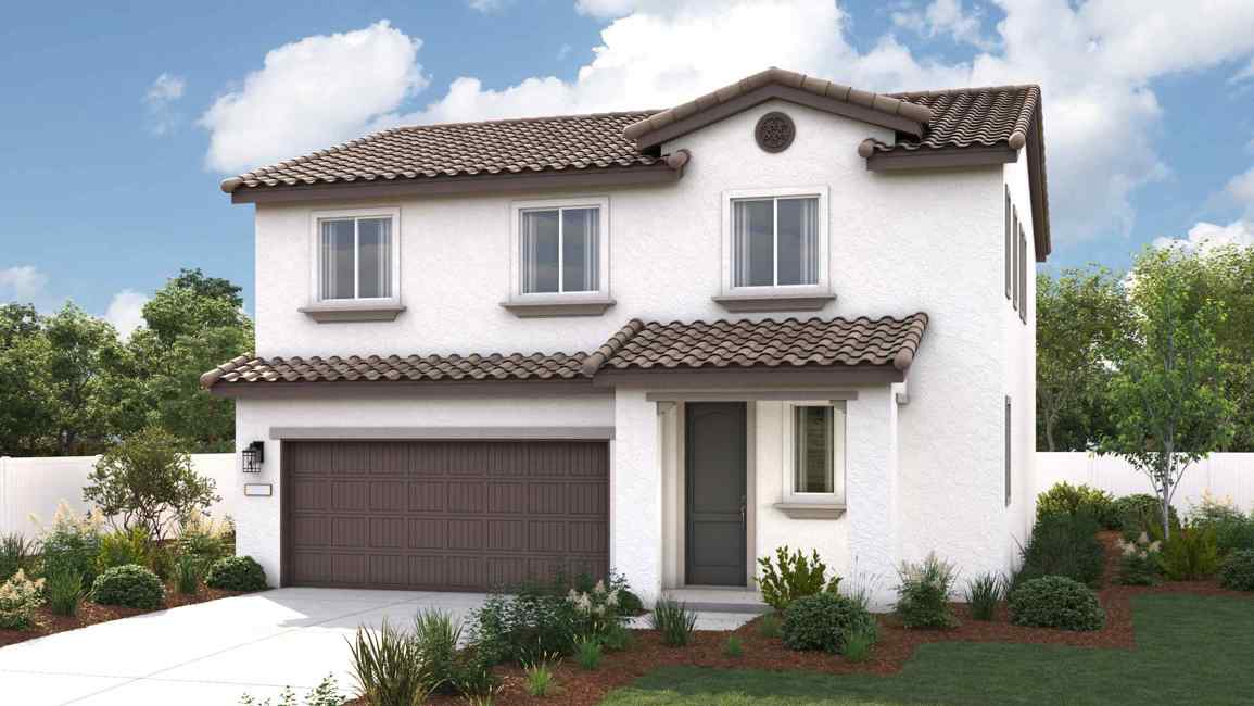 A white house with a garage.