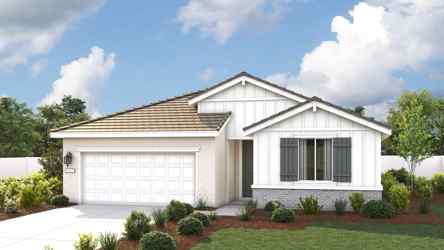 A house with a large yard with American Gothic House in the background.