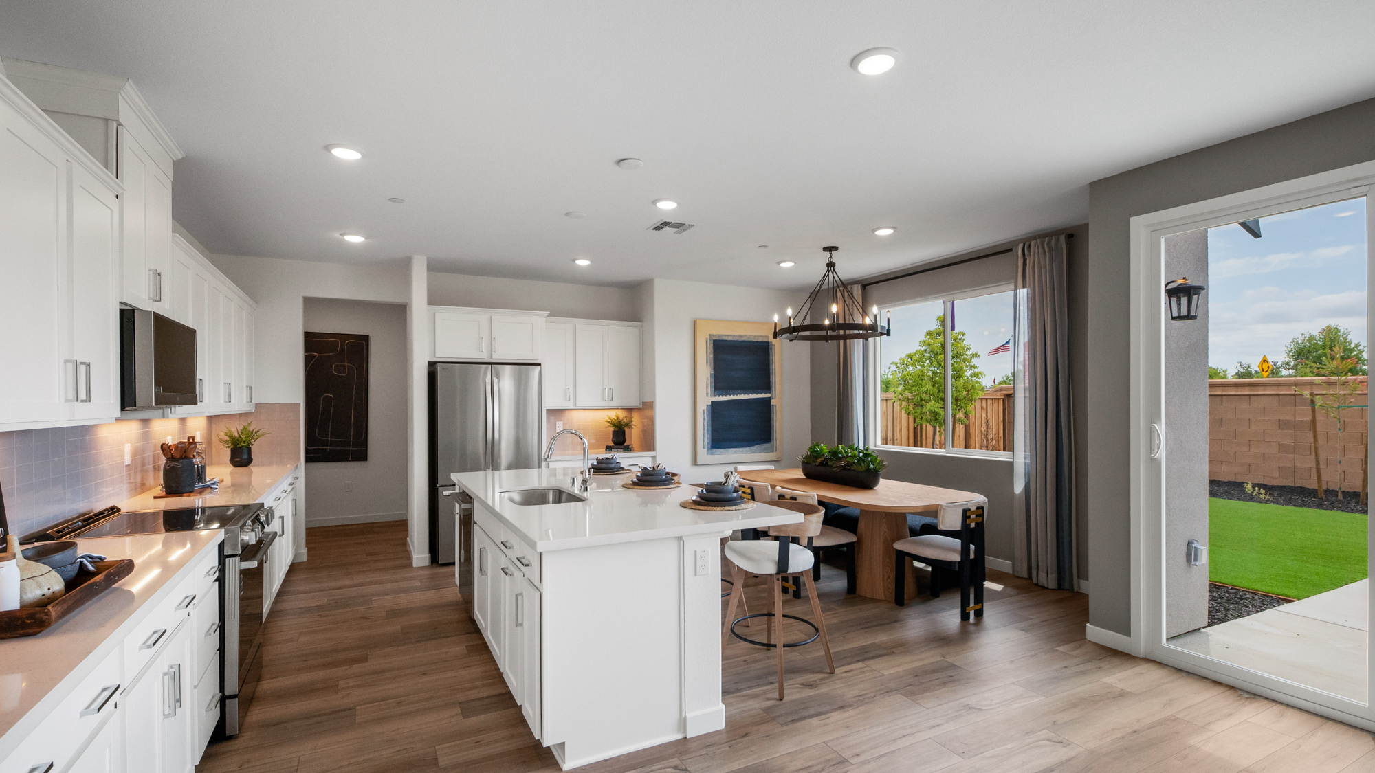 A kitchen with a wood floor.