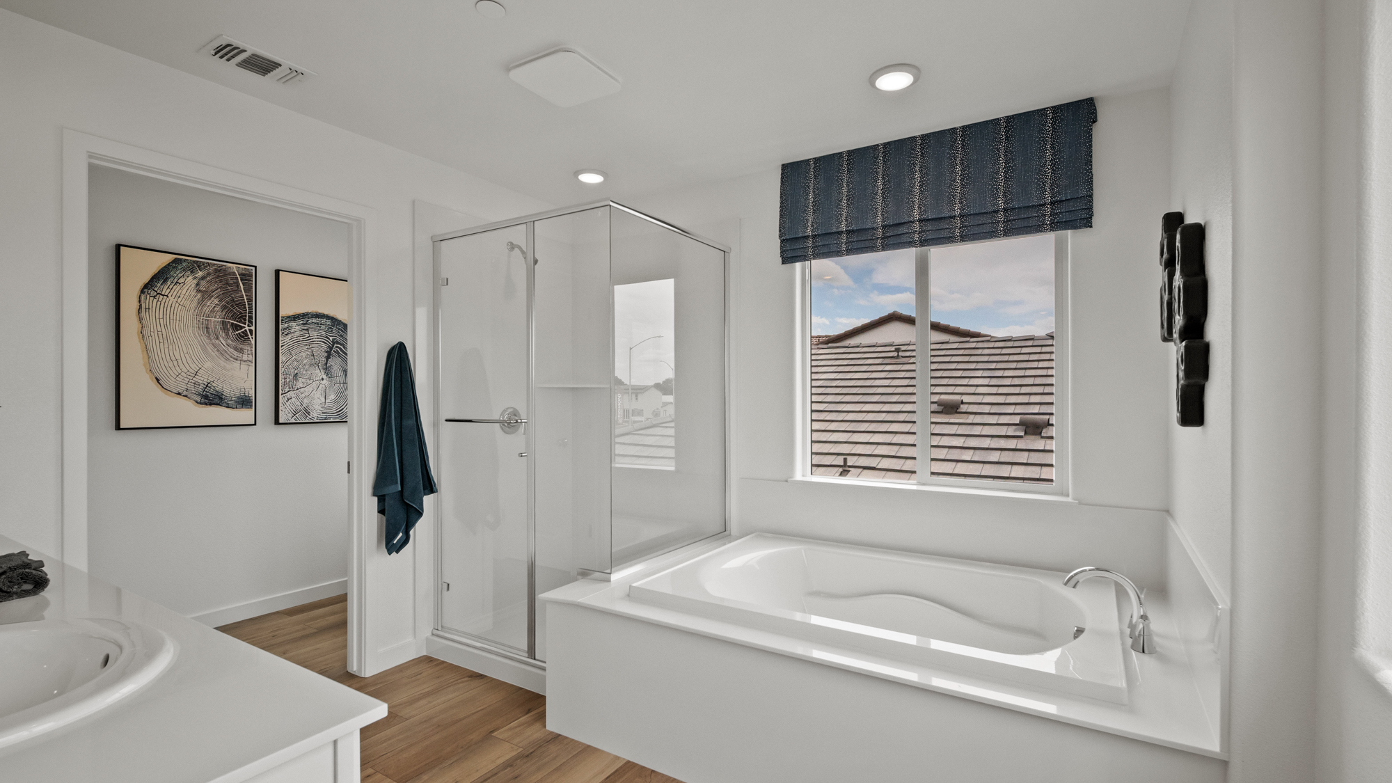 A bathroom with a tub and sink.