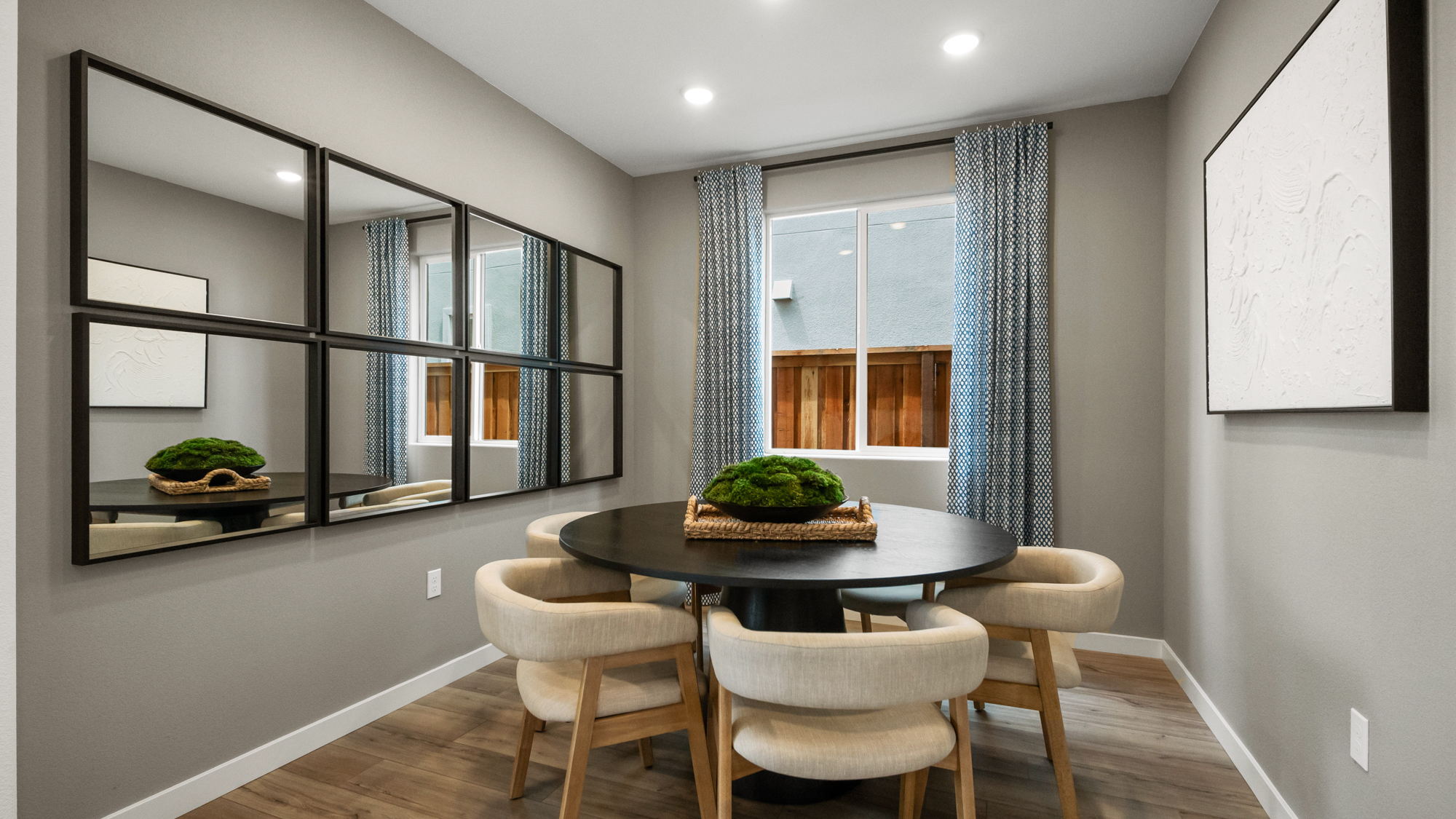 A room with a table and chairs.
