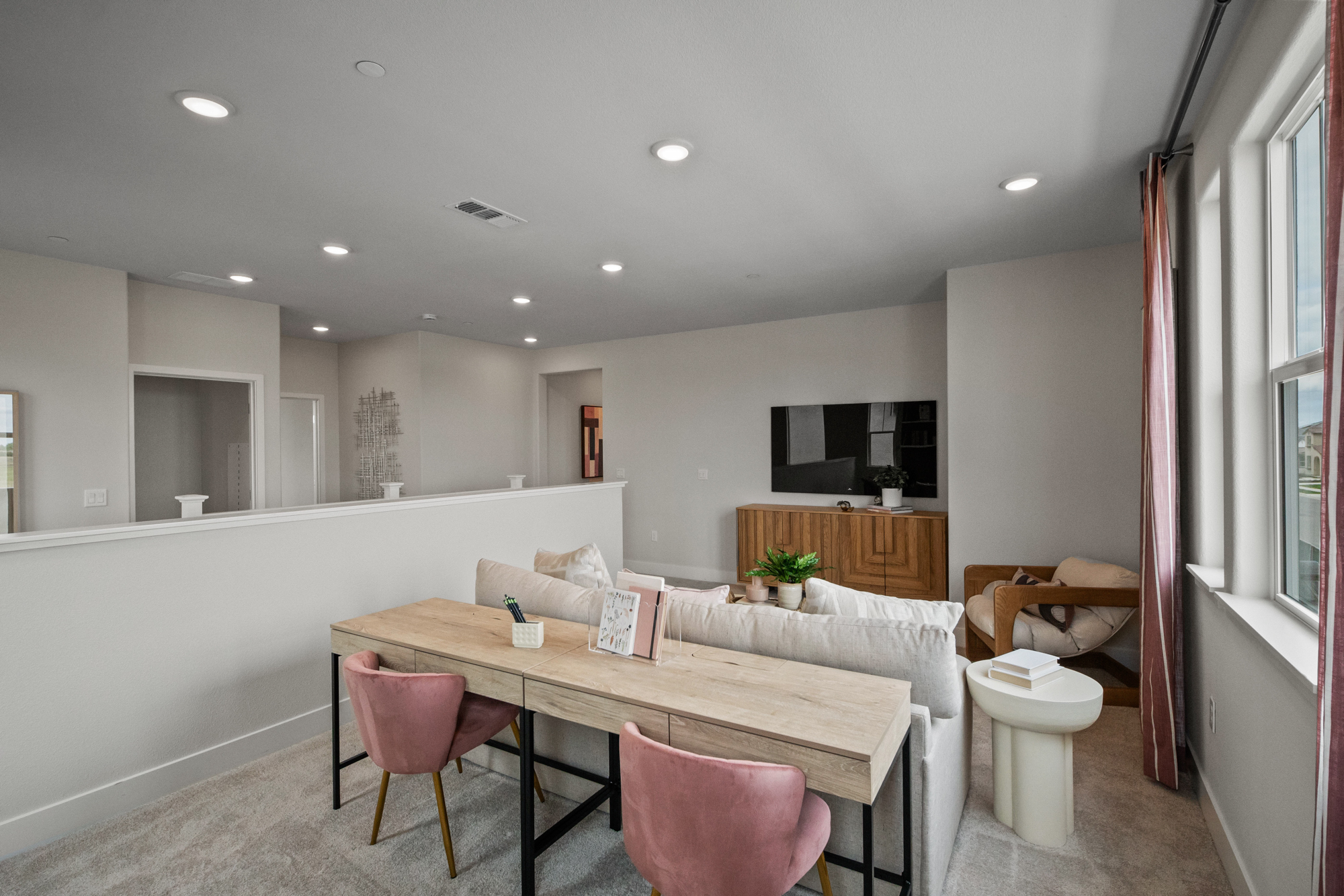 A room with a table and chairs.