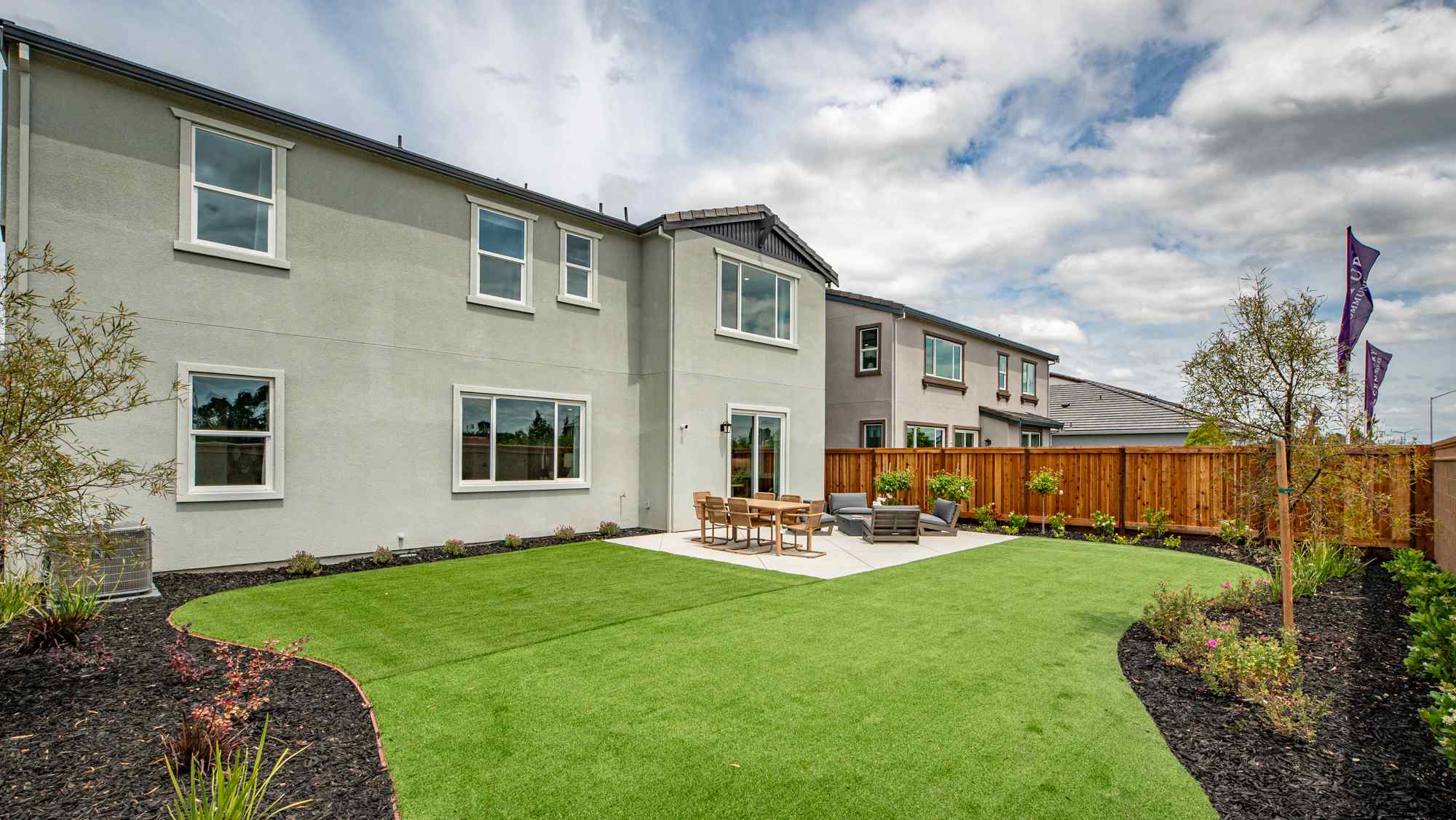 A house with a large front yard.