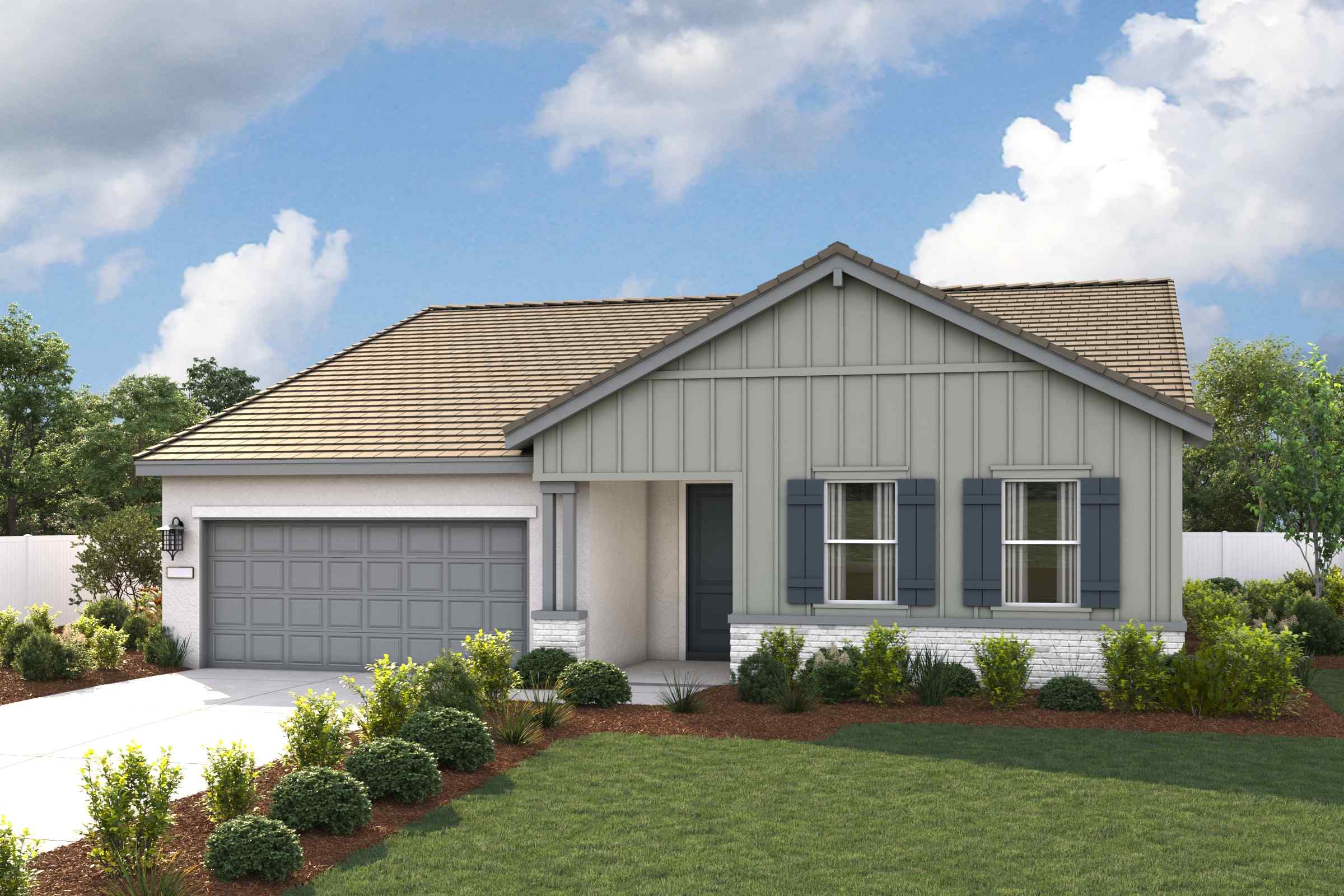 A house with a garage and a lawn in front of it.