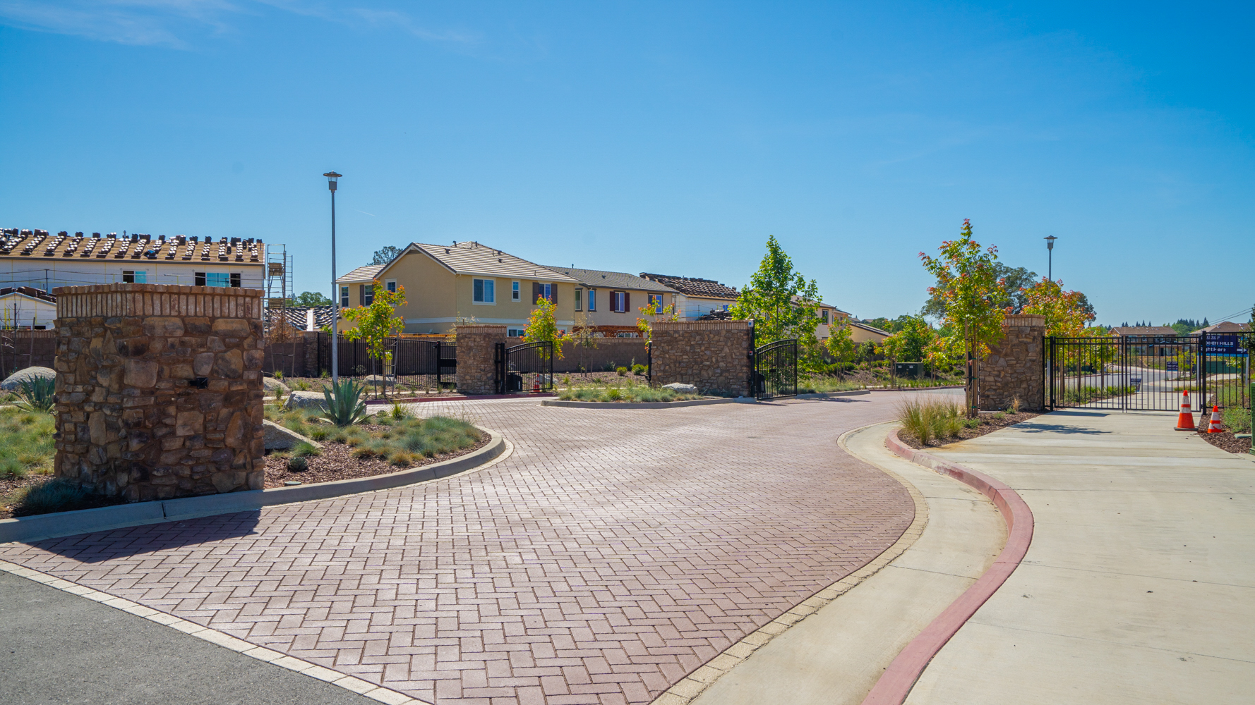 A brick walkway leading to a building.