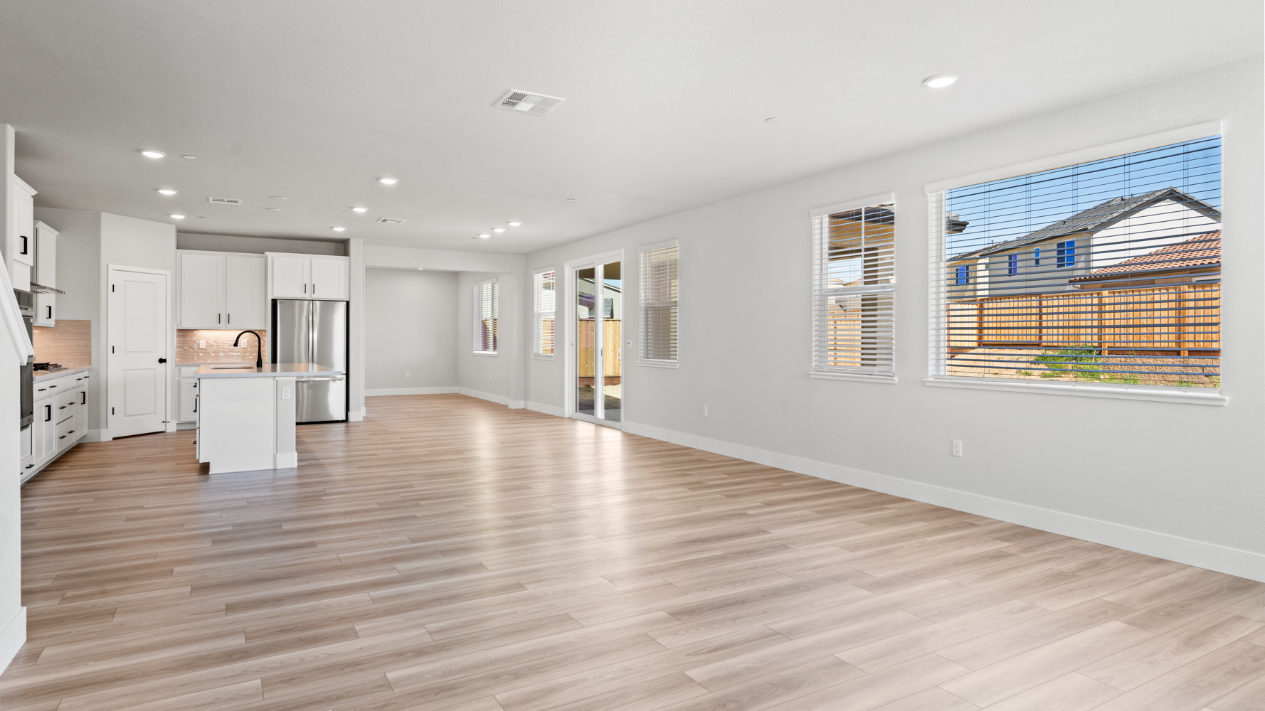 A large empty room with white walls.