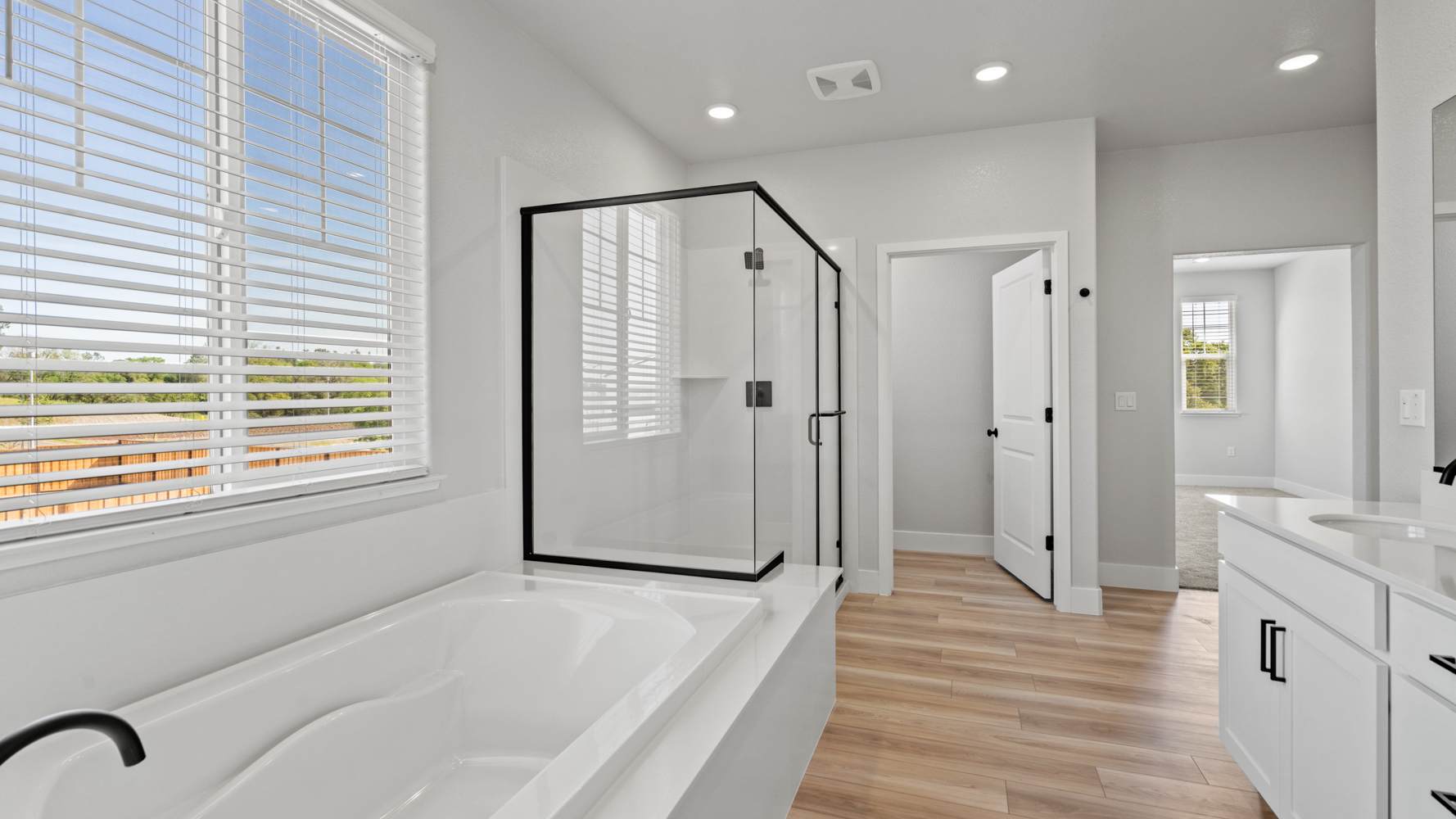 A bathroom with a tub and sink.