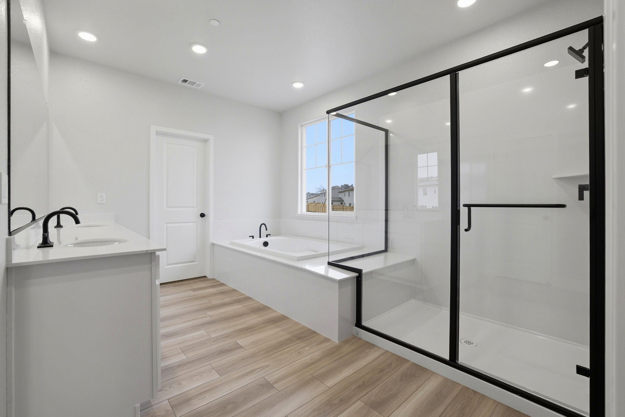 A bathroom with a glass shower.