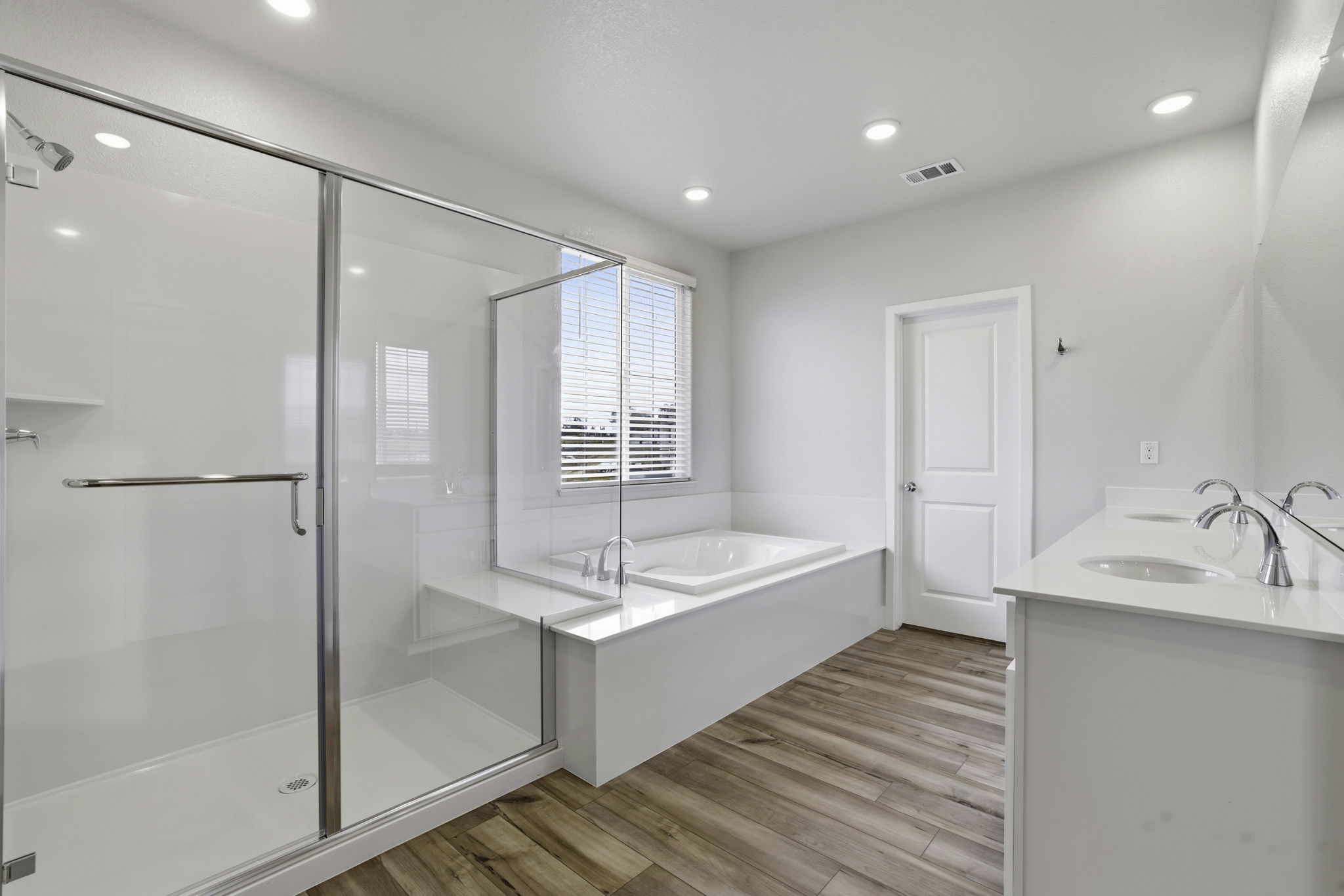 A bathroom with a glass shower.