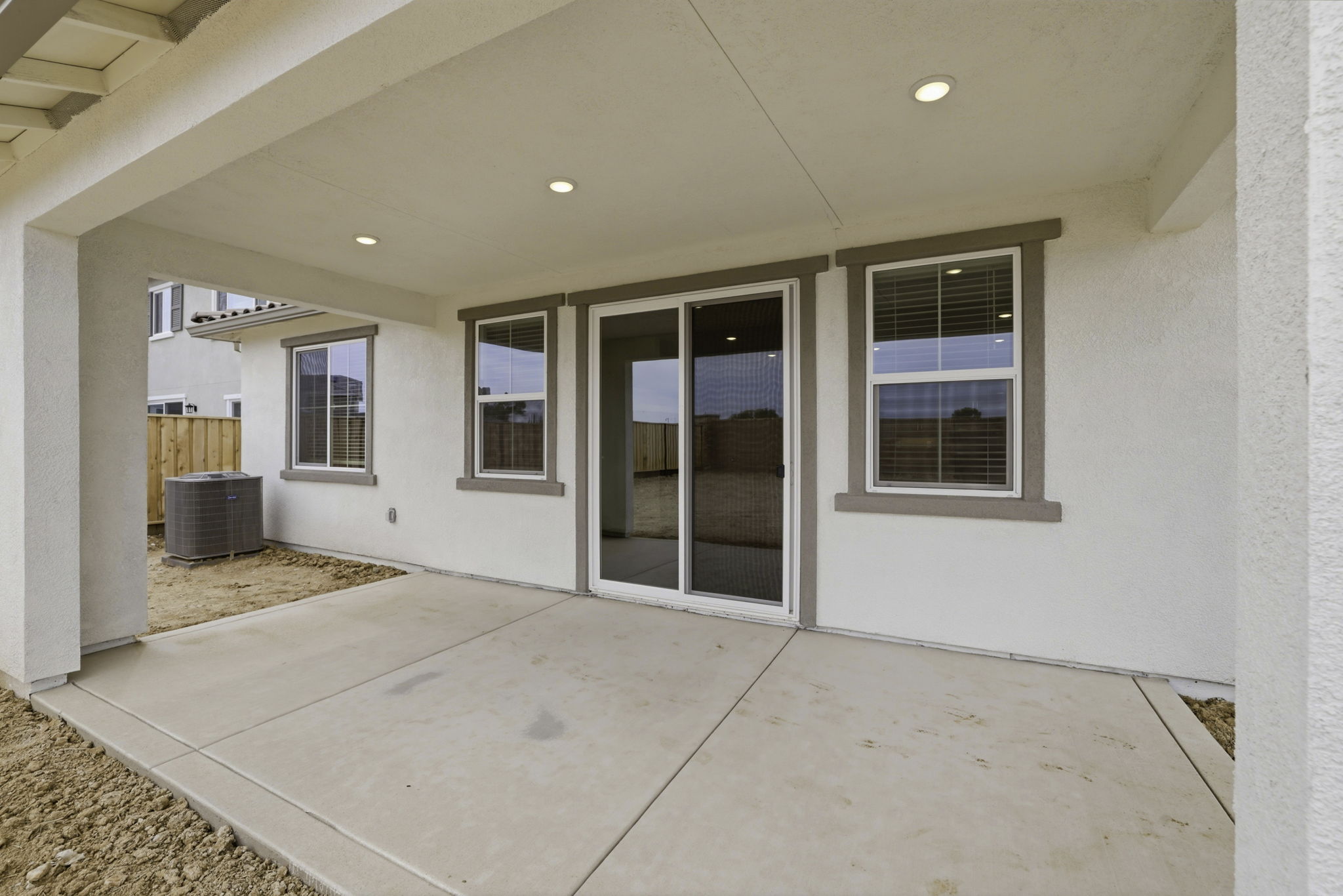 A room with a glass door and a window.