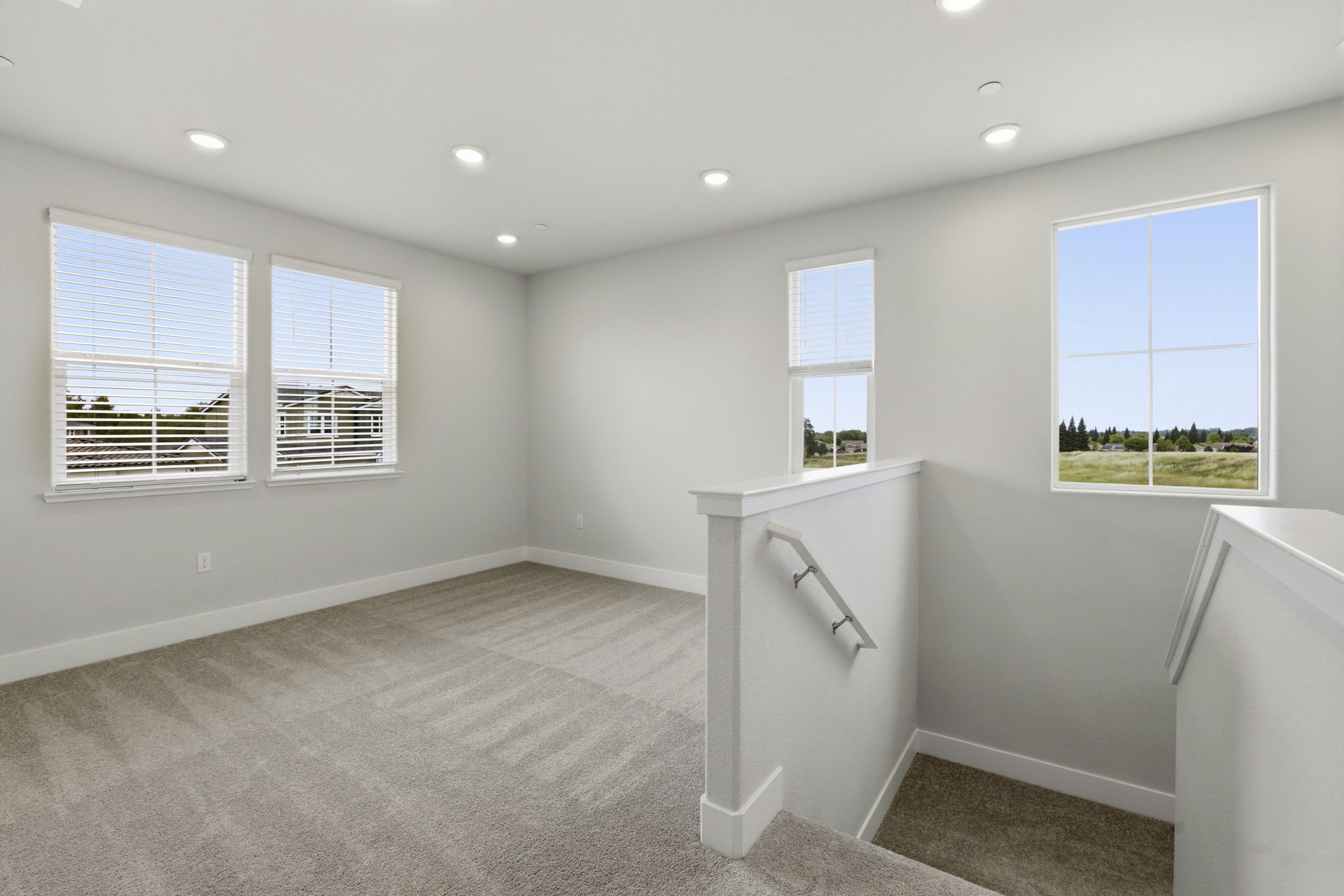 A room with a sink and windows.