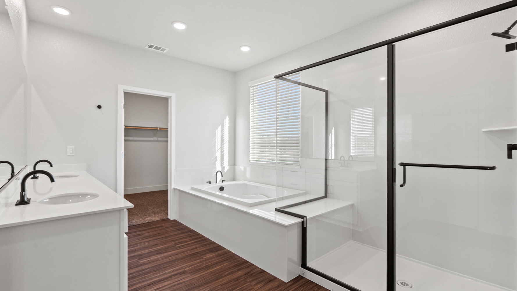A bathroom with a glass shower.