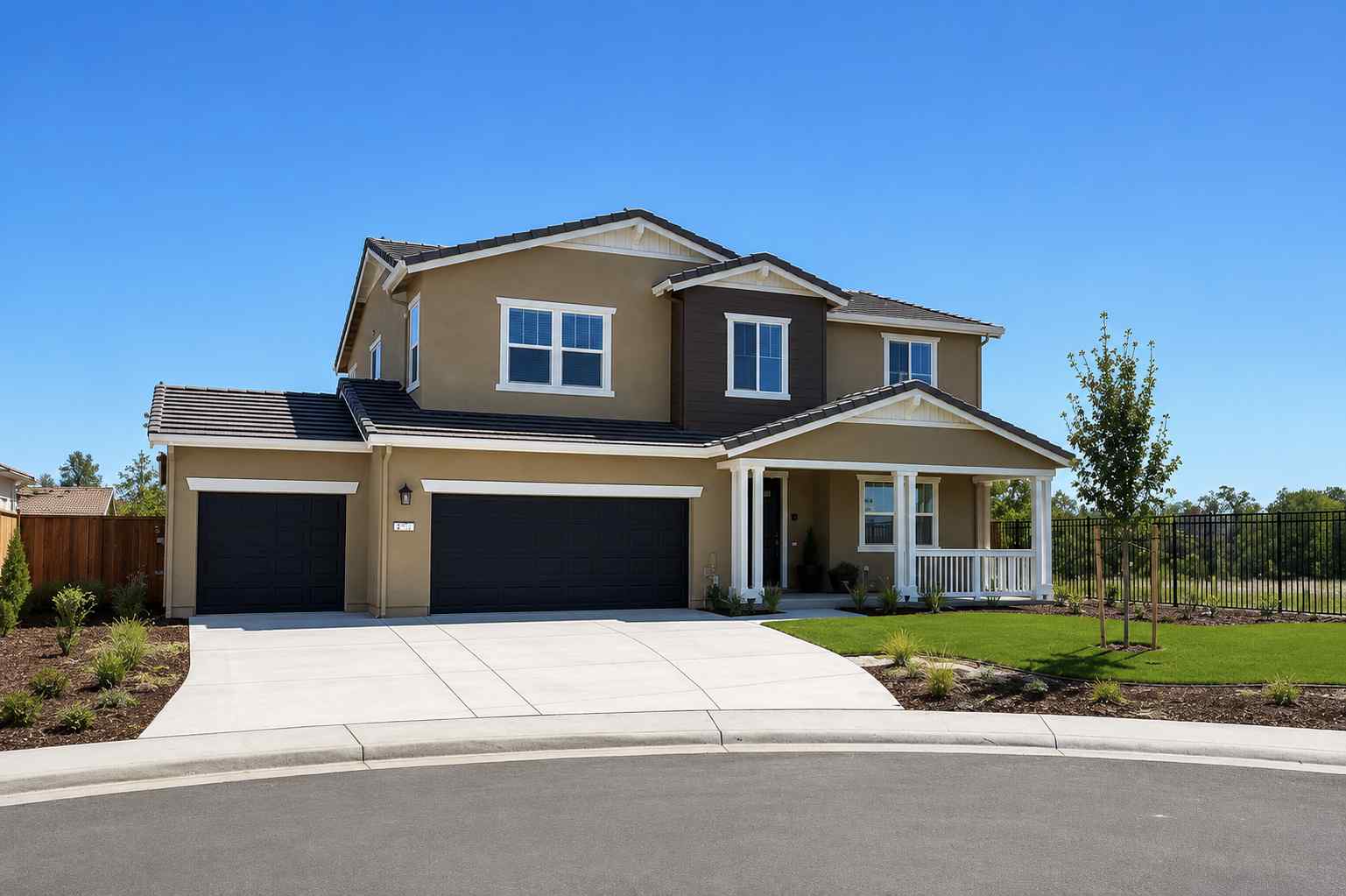 A house with a fence and grass.