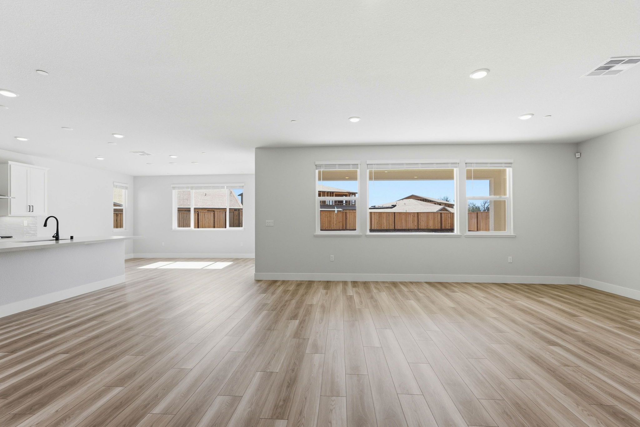 A large empty room with a large window.