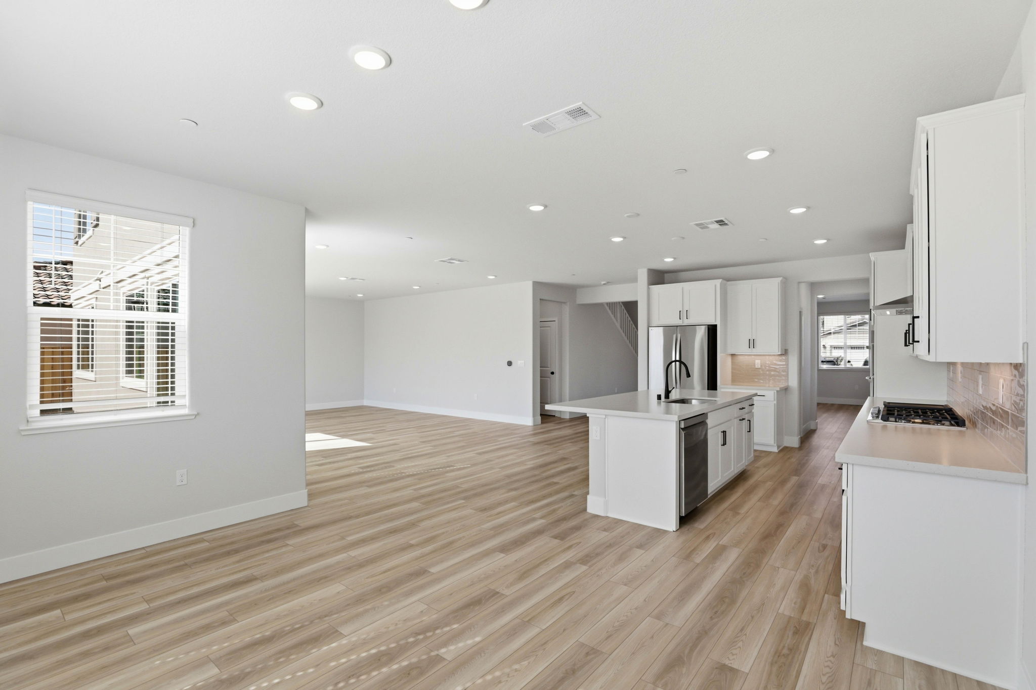 A large kitchen with white cabinets.