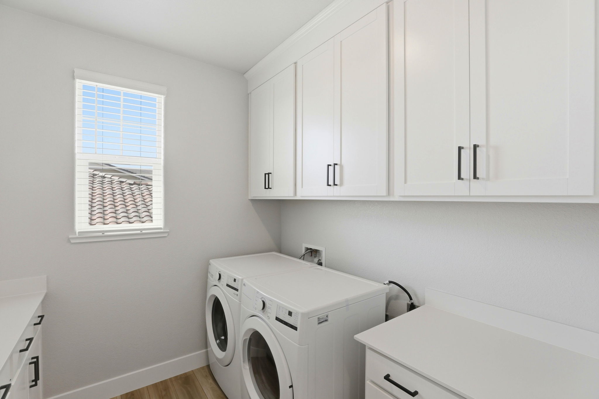 A white room with white cabinets.